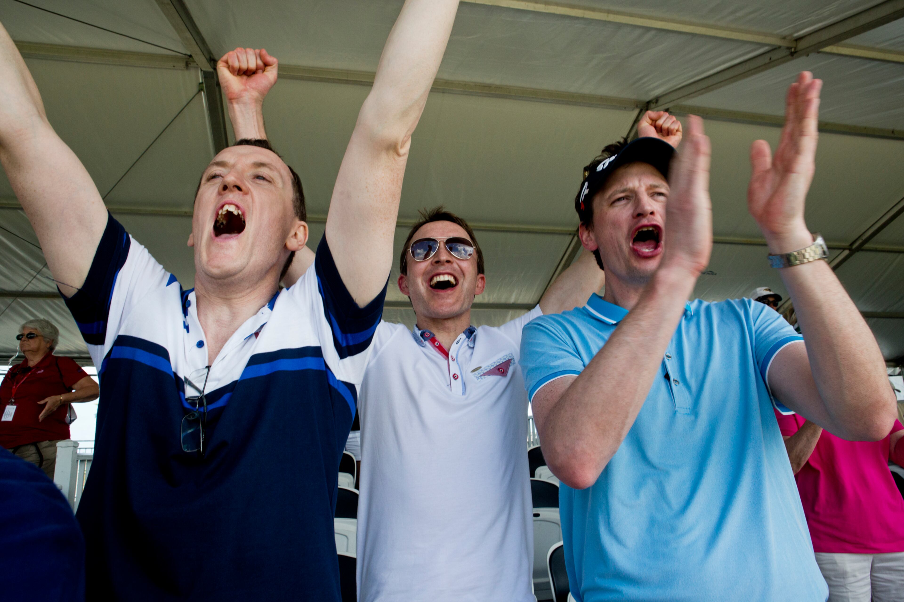 From left, Gerard Slevin, David O'Meara and Colin Galligan, who all traveled to the tournament from Ireland, cheer from the stands at the 17th hole after Padraig Harrington wins the Honda Classic during the final round at PGA National in Palm Beach Gardens on March 2, 2015. (Brianna Soukup / Palm Beach Post)