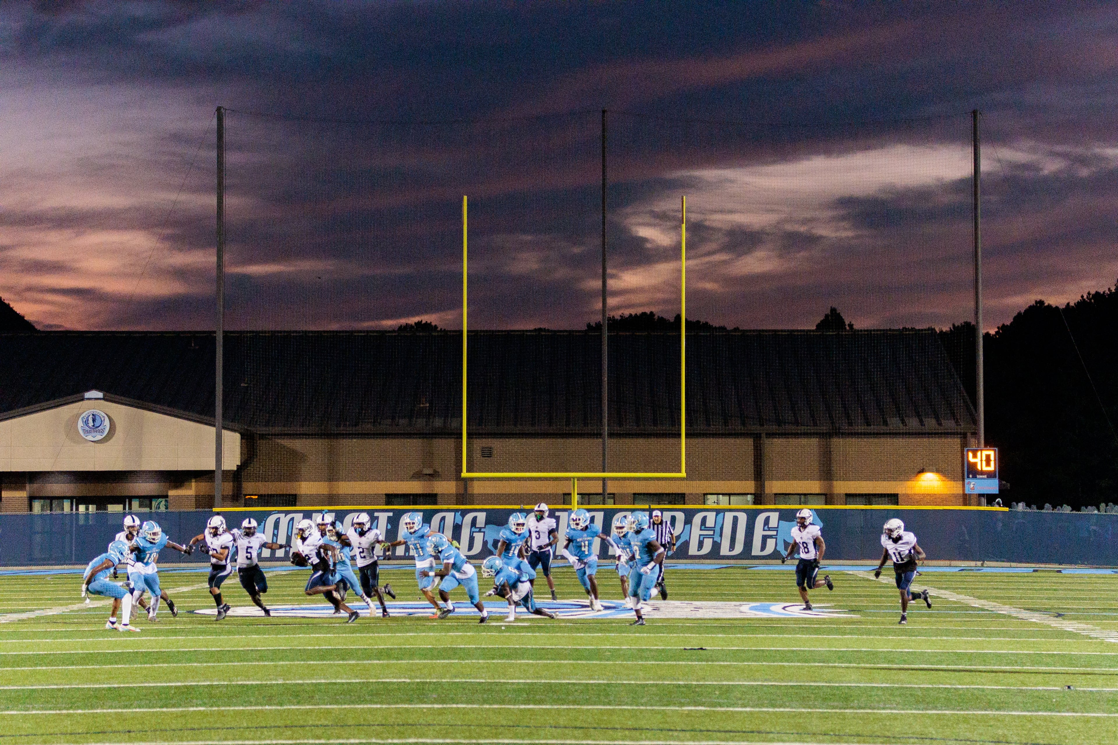 August 26 , 2022 Norcross - Meadowcreek and
South Gwinnett play against a dramatic sky in the first half at Meadowcreek High School in Norcross on Friday, August 26, 2022. (Arvin Temkar / arvin.temkar@ajc.com)