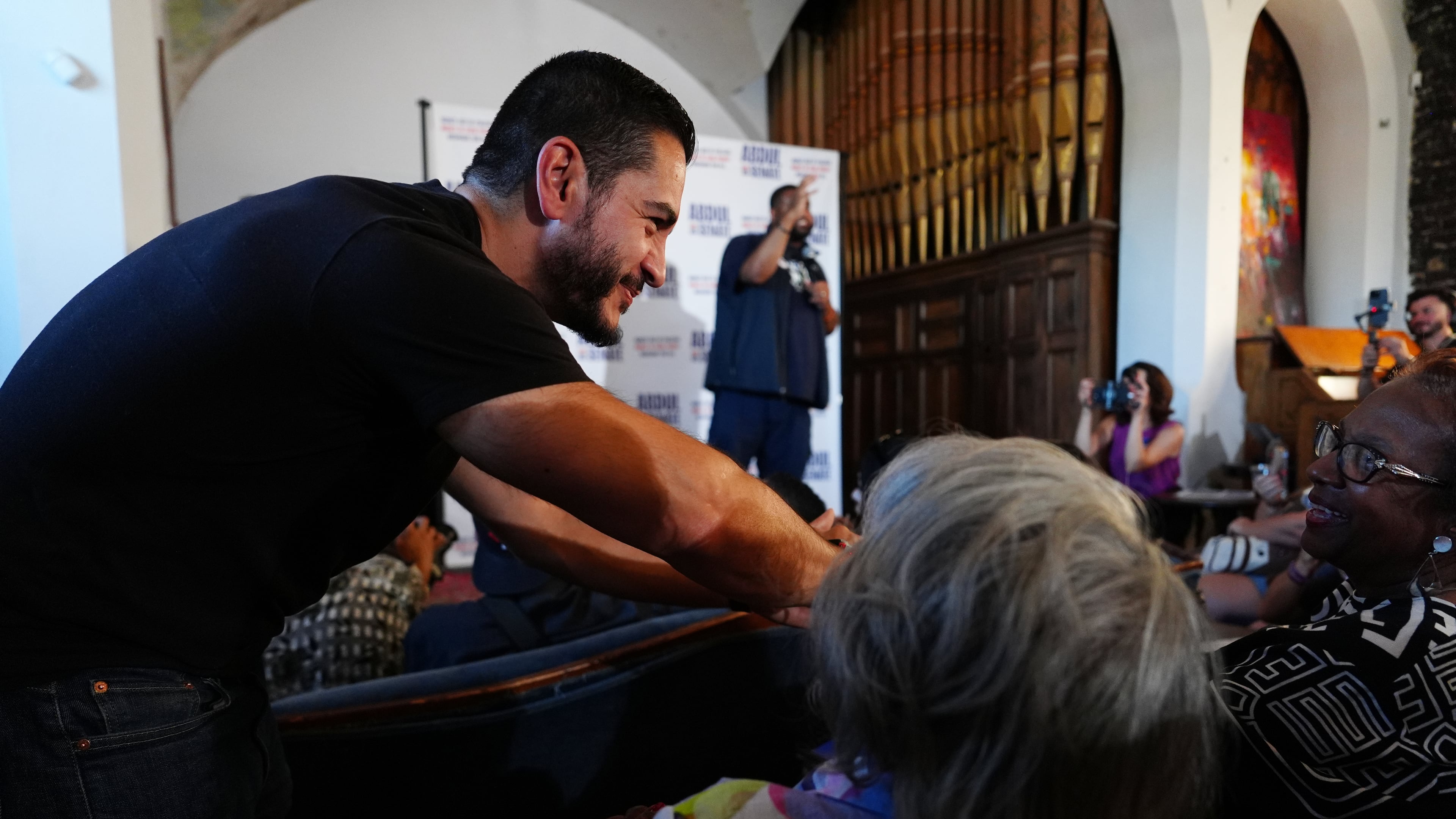 Abdul El-Sayed, a progressive candidate in the Democratic primary for U.S. Senate in Michigan, greets people at a campaign rally, Monday, Aug. 3, 2026, in Detroit. (AP Photo/Julia Demaree Nikhinson)