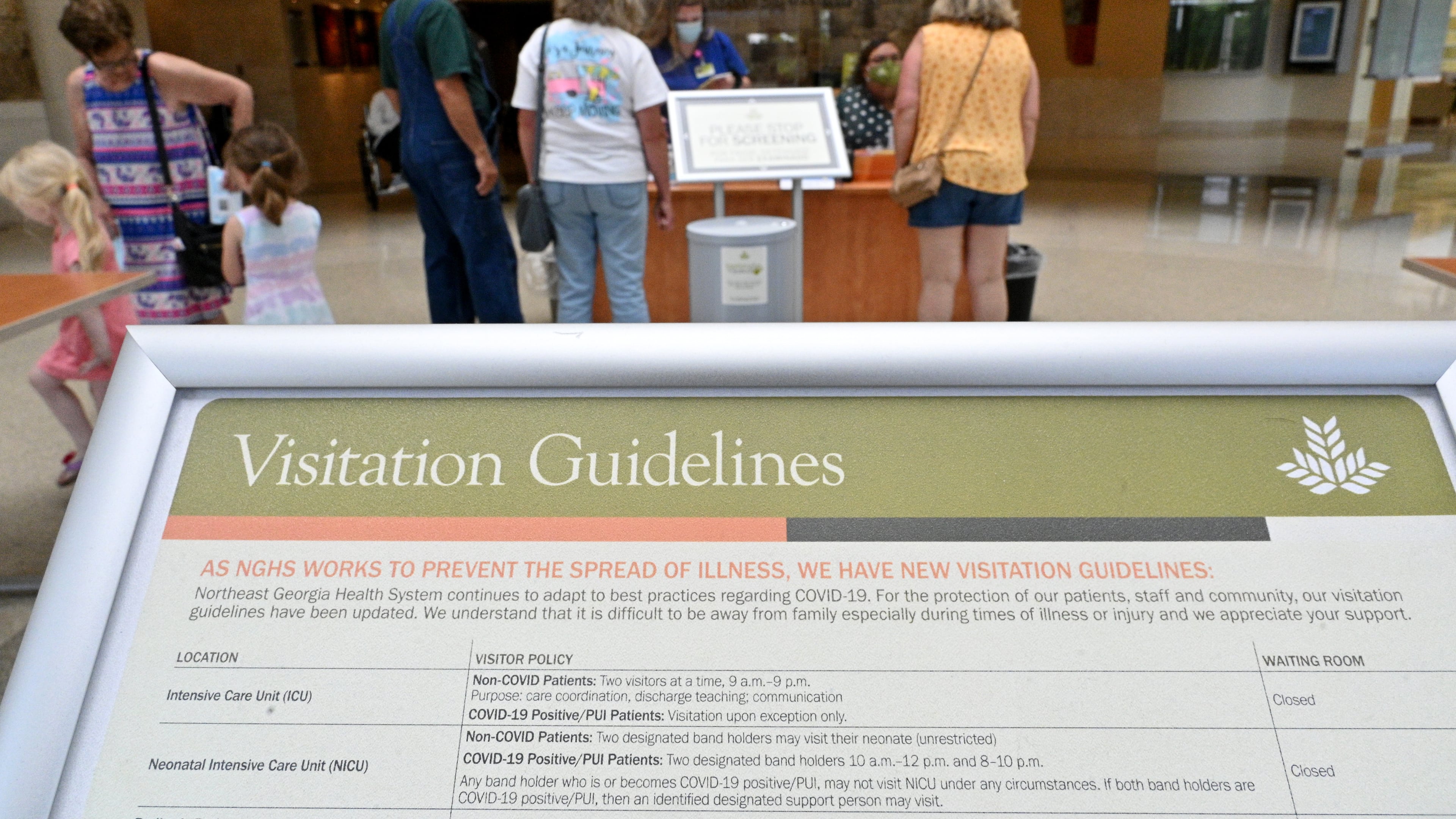 Updated visitation guidelines are displayed at North Patient Tower of Northeast Georgia Medical Center in Gainesville. (Hyosub Shin / Hyosub.Shin@ajc.com)