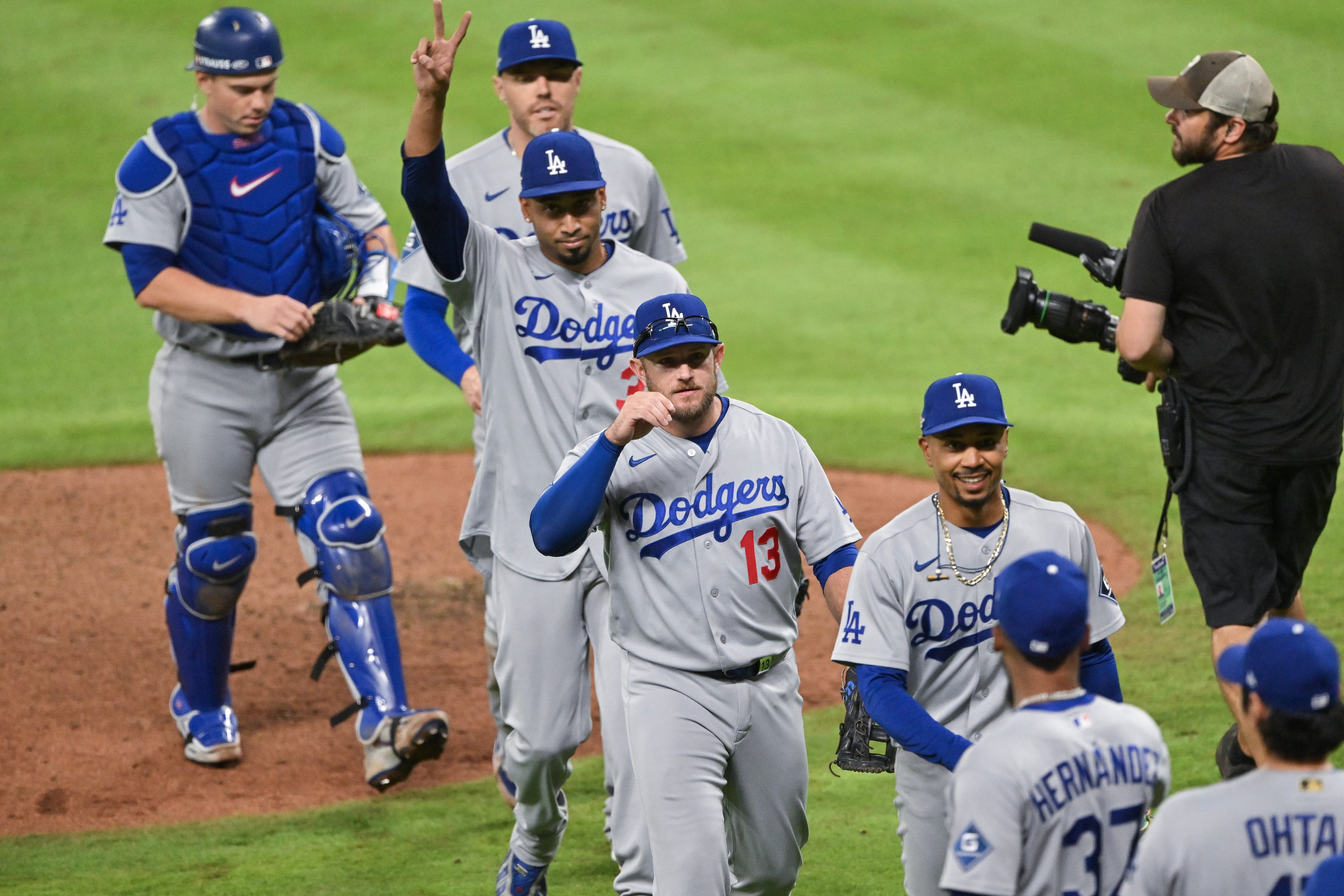 The Los Angeles Dodgers celebrate after defeating the Atlanta Braves during the ninth inning of Game 3 of the MLB National League Division Series between the Atlanta Braves and the Los Angeles Dodgers, Tuesday, Oct. 6, 2026, in Atlanta. (Hyosub Shin/AJC)