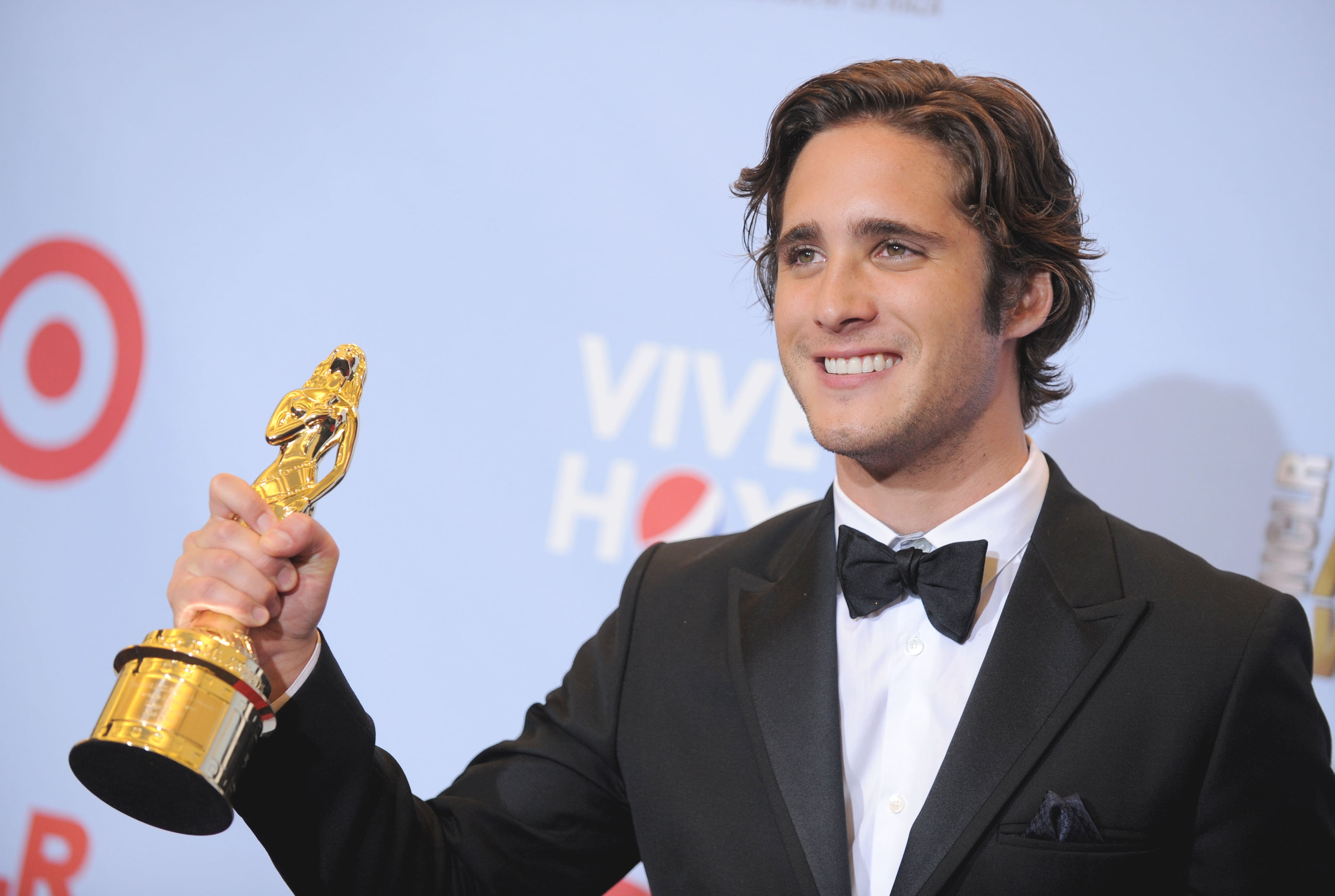 Diego Boneta poses backstage with the award for favorite movie actor.