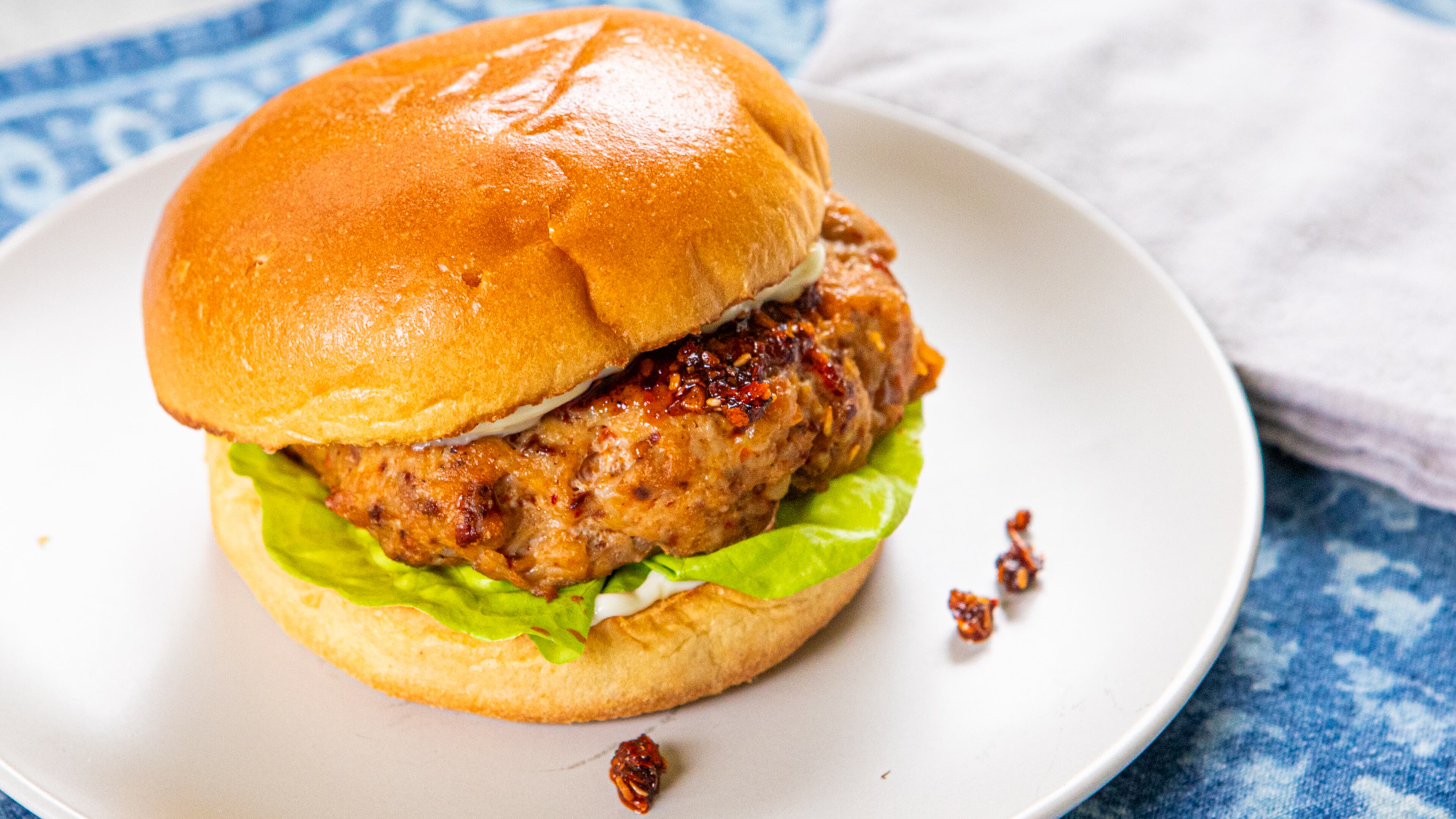 Chili Crisp Chicken Burgers. (Aaliyah Man for the AJC/Food styling by Kate Williams.)