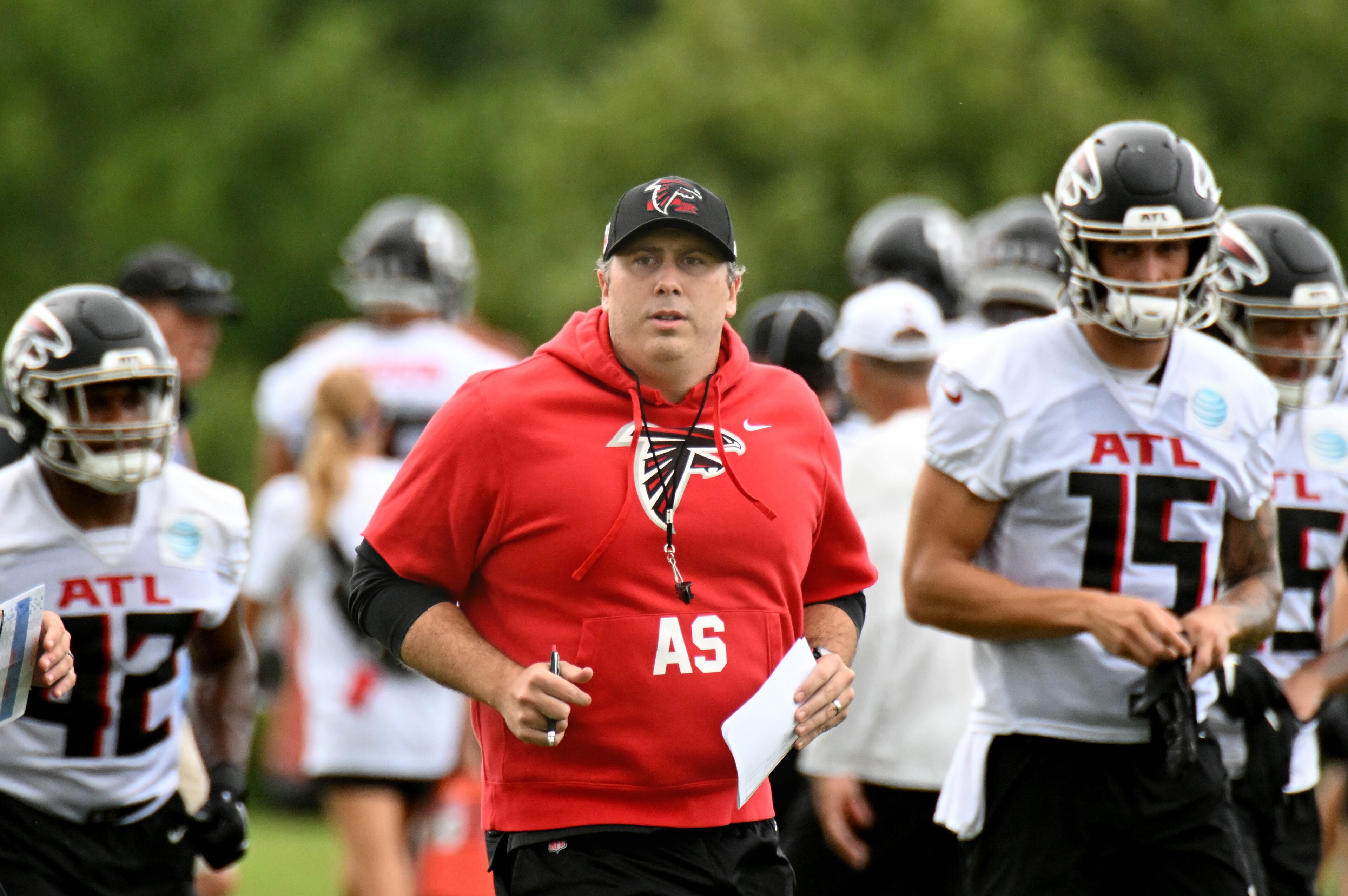Falcons coach Arthur Smith runs onto the field during a joint practice with the Jaguars on Thursday in Flowery Branch. (Hyosub Shin / Hyosub.Shin@ajc.com)