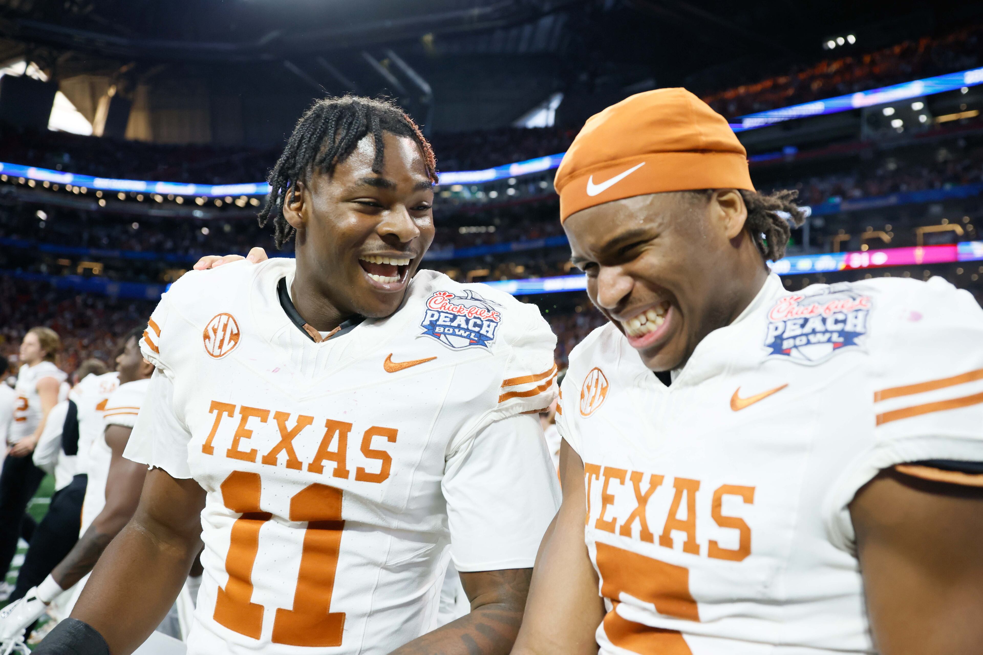 Texas Longhorns wide receivers Silas Bolden (11) and Ryan Wingo (5) smile after defeating the Arizona State Sun Devils 39-31 in double overtime at the Chick-fil-A Peach Bowl held at Mercedes-Benz Stadium on Wednesday, January 1, 2025, in Atlanta.
(Miguel Martinez / AJC)