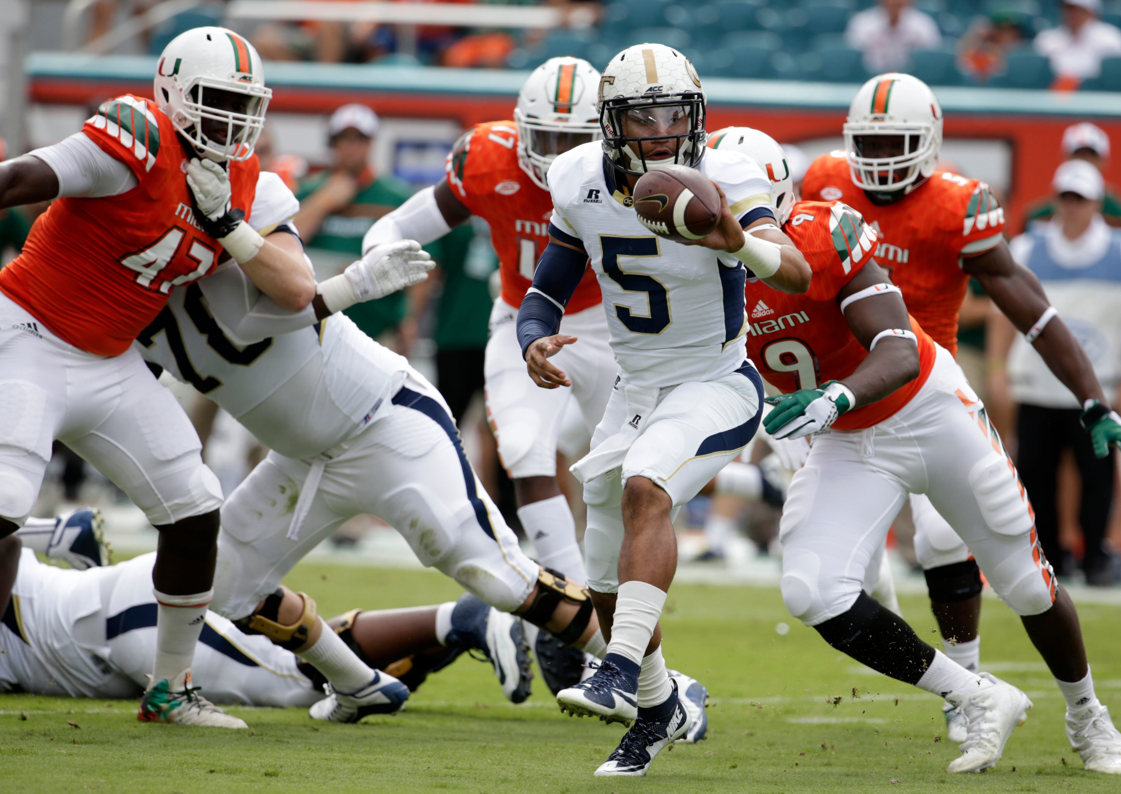 Georgia Tech quarterback Justin Thomas (5) prepares to throw a short pass during the first half of an NCAA college football game against Miami, Saturday, Nov. 21, 2015 in Miami Gardens, Fla. (AP Photo/Lynne Sladky)
