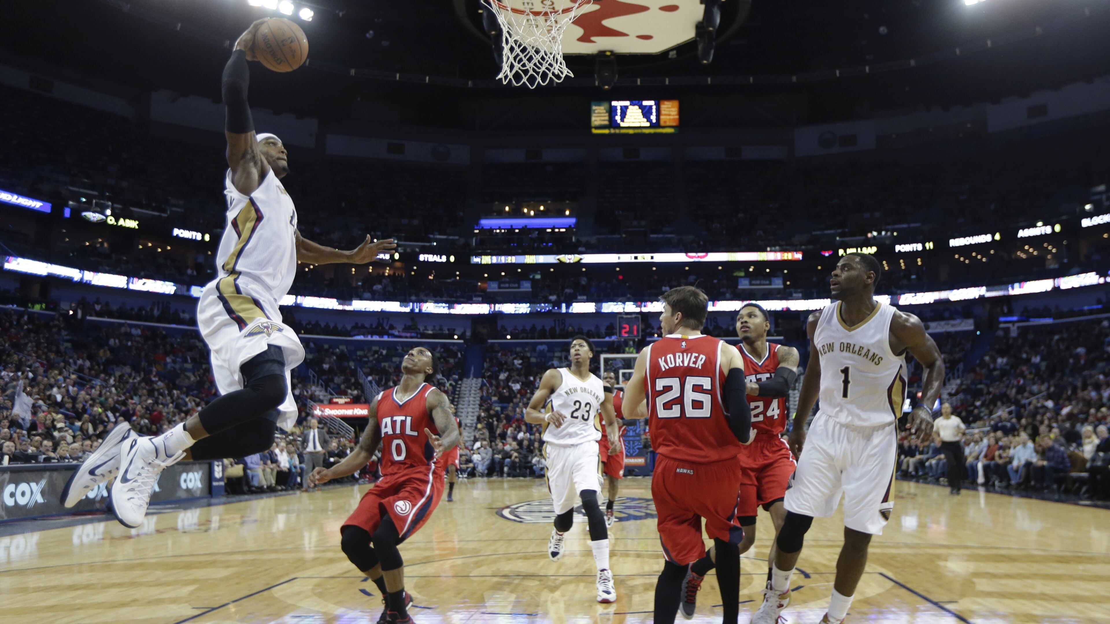 New Orleans Pelicans forward Dante Cunningham (44) slam dunks in the second half of an NBA basketball game against the Atlanta Hawks in New Orleans, Monday, Feb. 2, 2015. The Pelicans won 115-100. (AP Photo/Gerald Herbert)