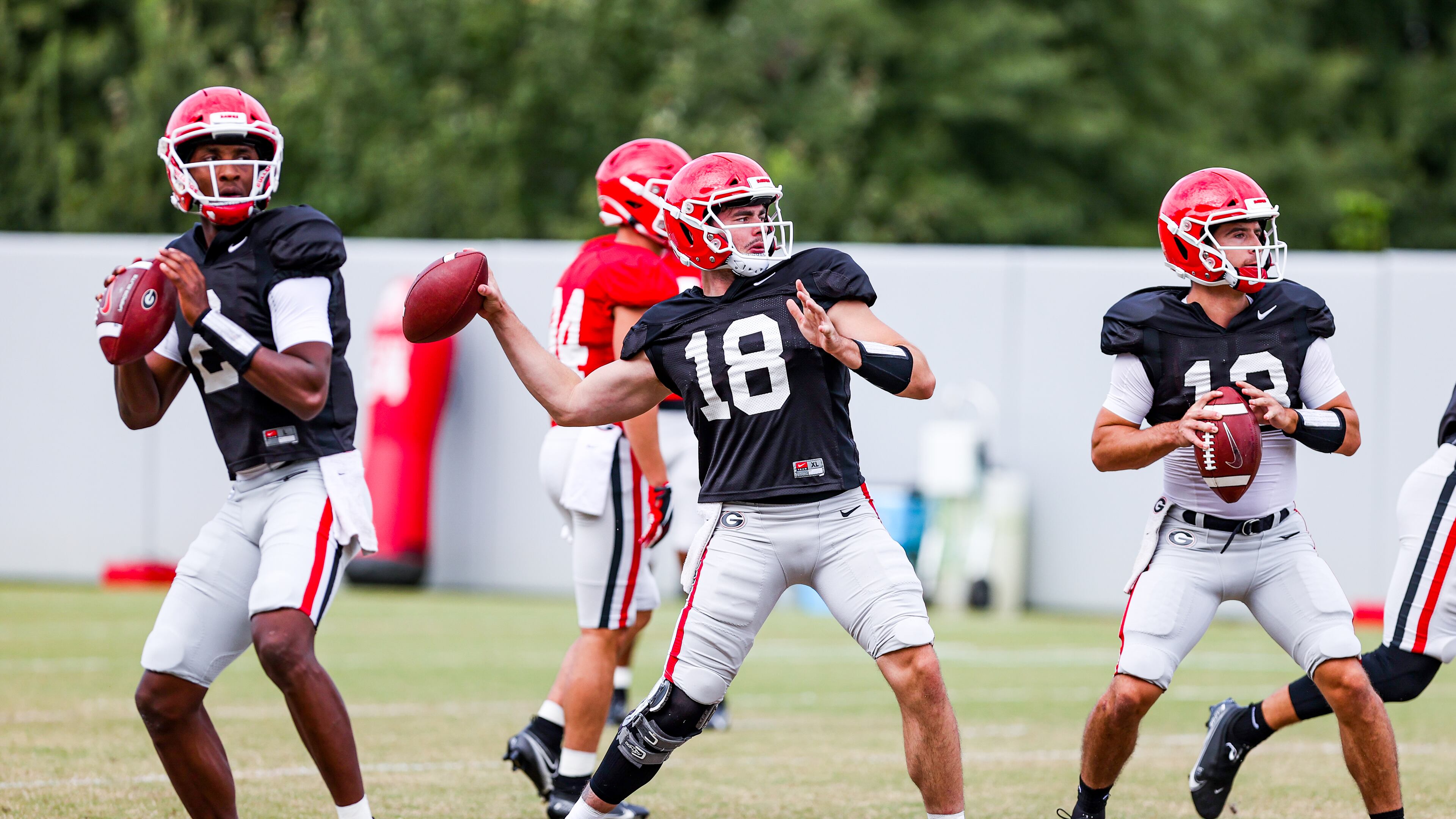 Georgia quarterback D'Wan Mathis (2), Georgia quarterback JT Daniels (18), Georgia quarterback Stetson Bennett (13) during the Bulldogs’ practice session in Athens, Ga., on Monday, Sept. 21, 2020. (Photo by Tony Walsh)