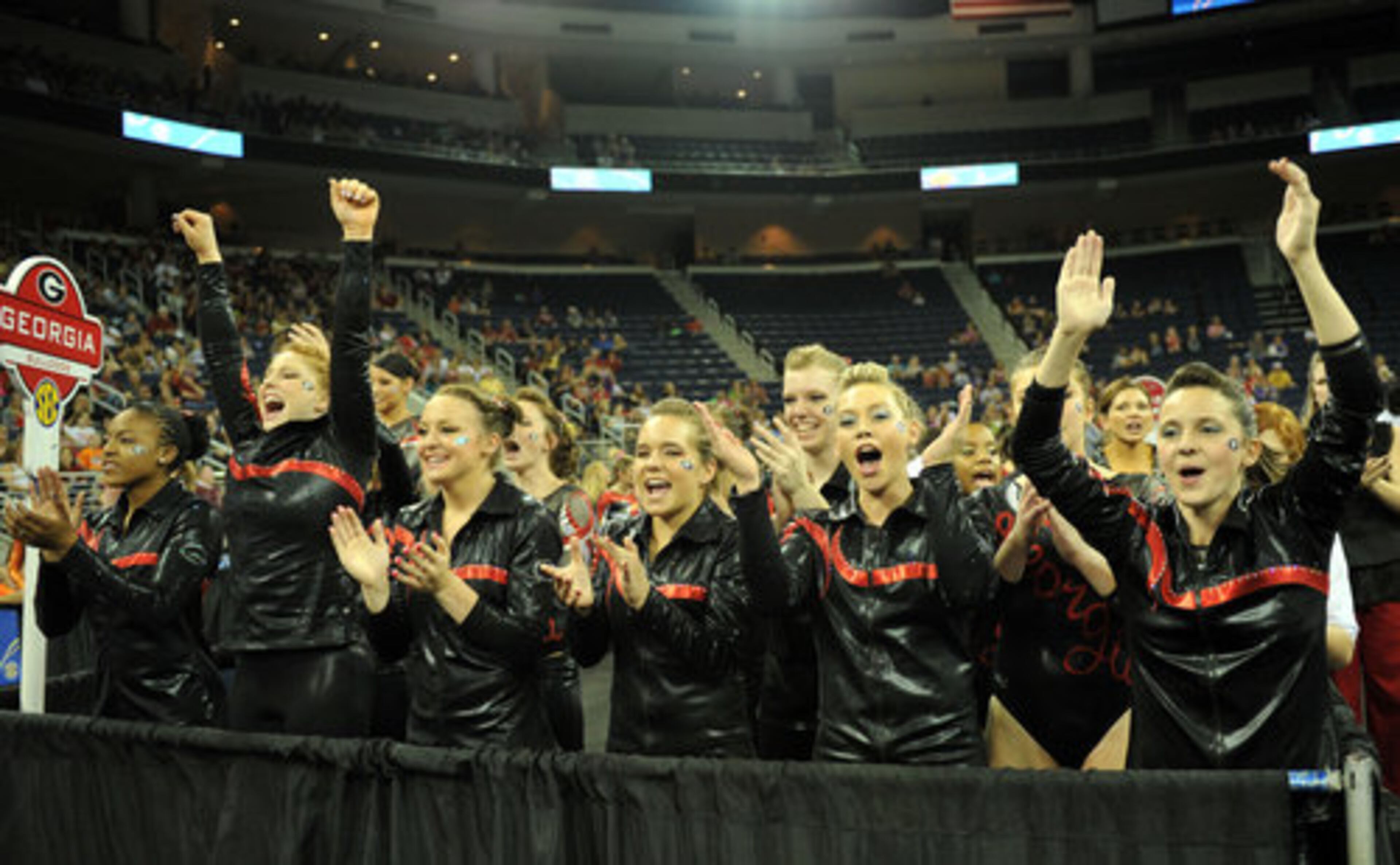 University of Georgia gymnasts cheer for their teammates.