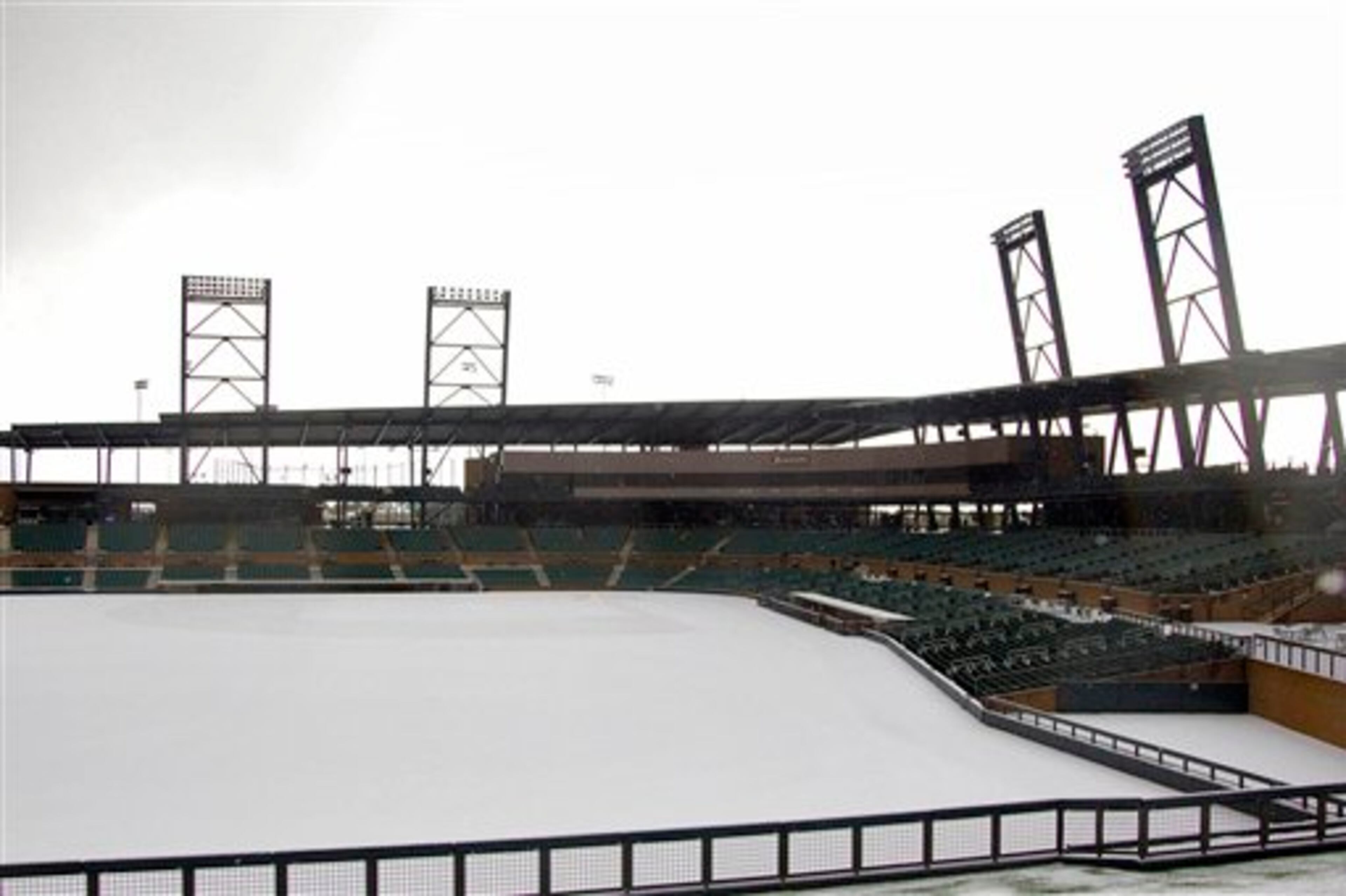 In this photo provided by the Arizona Diamondbacks, snow covers Salt River Fields baseball park, Wednesday, Feb. 20, 2013, in Scottsdale, Ariz. Snow, hail and rain left a blanket of white in parts of the Phoenix metro area Wednesday afternoon. (AP Photo/Arizona Diamondbacks, L.M. Parr) NO SALES