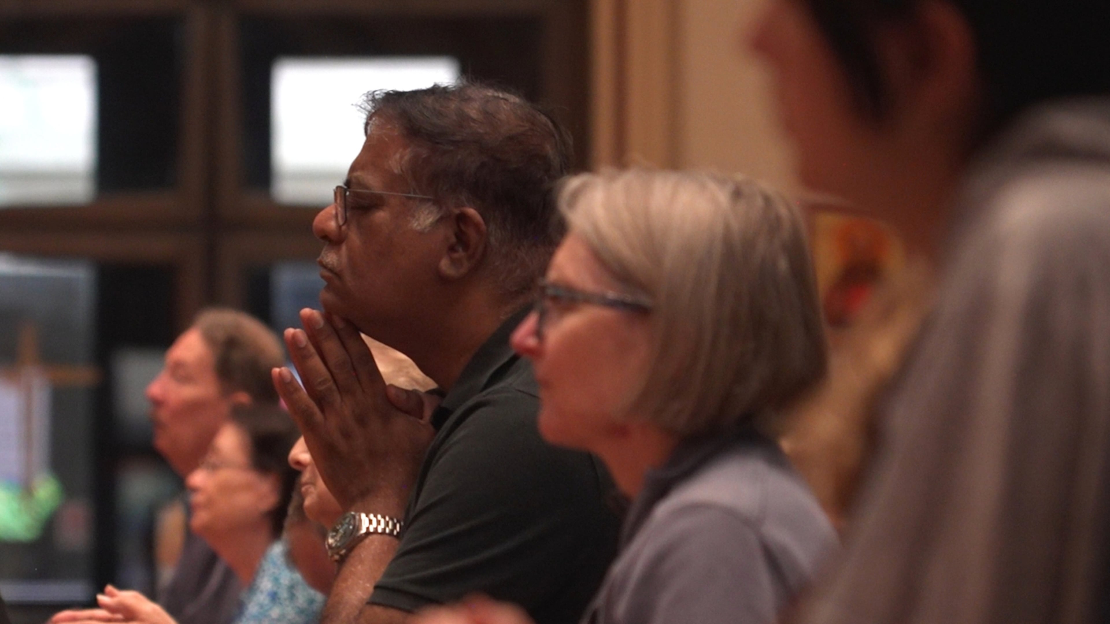 In this screengrab made from video, people pray at a votive mass for Pope Leo XIV in light of his lung cancer diagnosis at Holy Name Cathedral in Chicago, Wednesday, Oct. 14, 2026. (AP Photo/Laura Bargfeld)