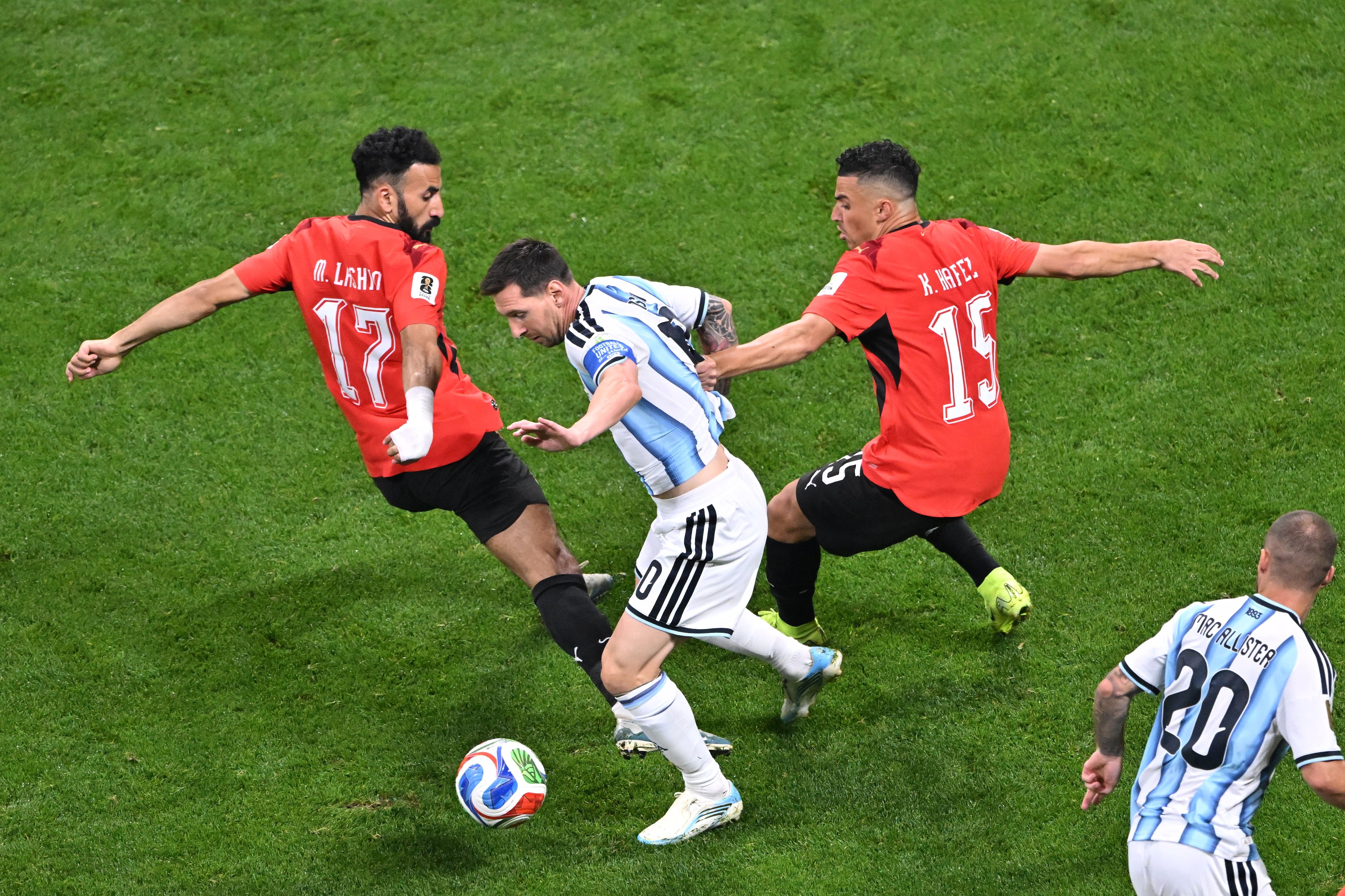 Argentina forward Lionel Messi (10) gets double covered by Egypt midfielder Mohanad Lasheen (17) and Egypt defender Karim Hafez (15) during the first half of the Argentina vs. Egypt FIFA World Cup game on Tuesday, July 7, 2026, in Atlanta. (Hyosub Shin/AJC)