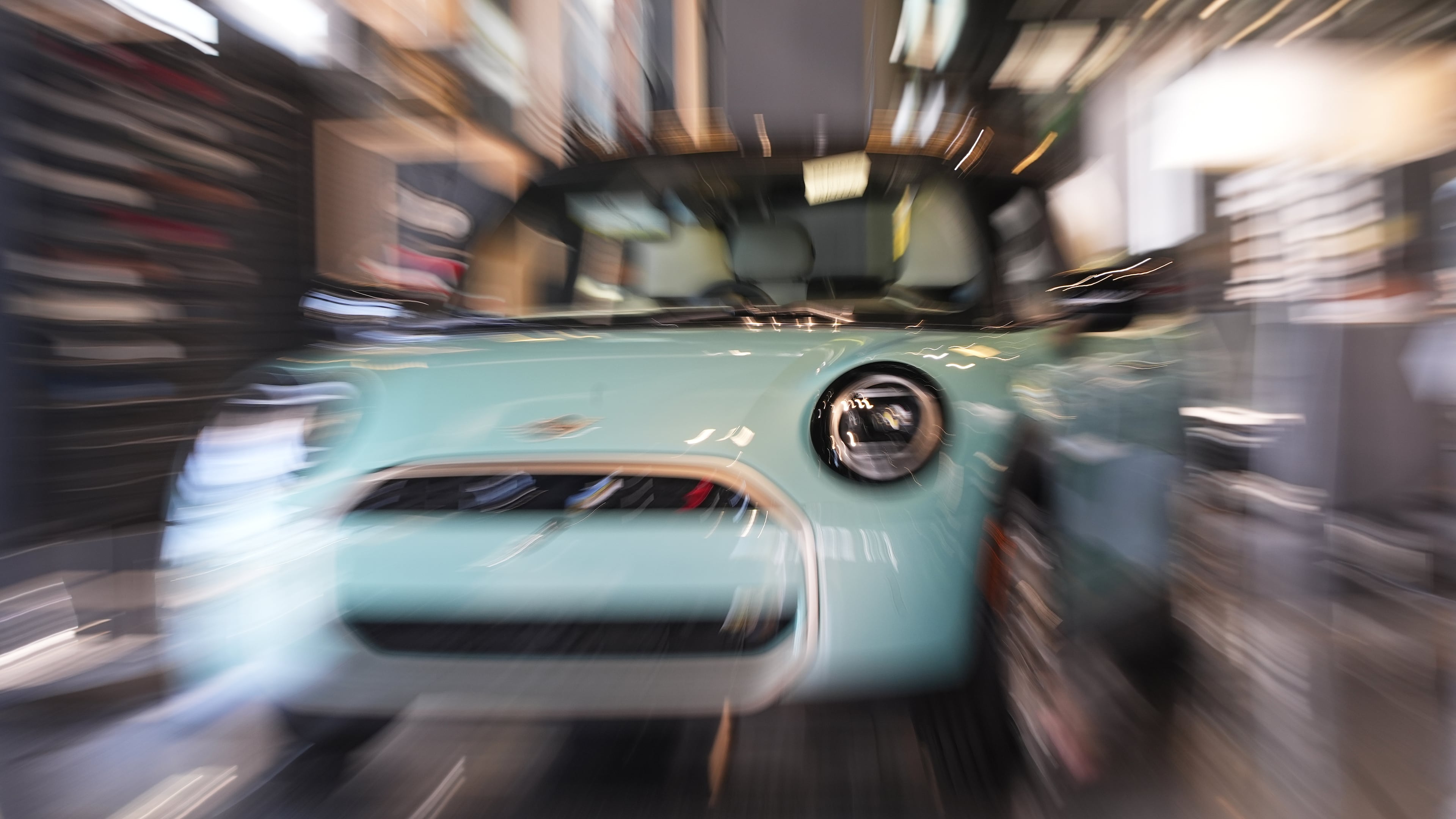 FILE - Made with a slow shutter speed and zoom lens, an unsold 2026 Cooper S hardtop is diplayed in a Mini dealership Friday, Oct. 24, 2025, in Highlands Ranch, Colo. (AP Photo/David Zalubowski, File)