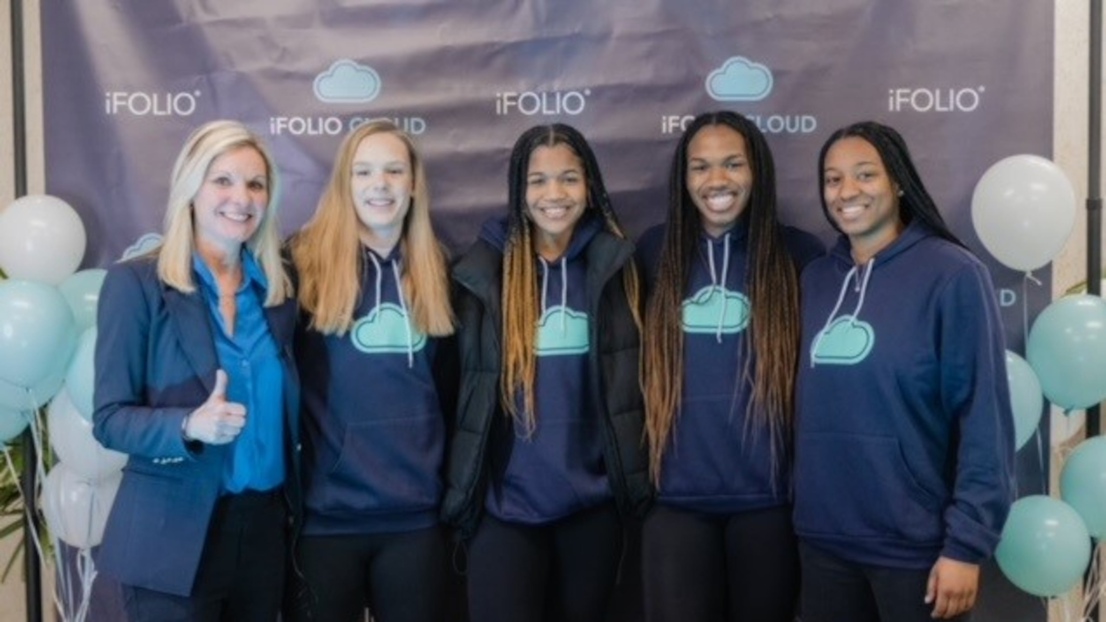 Jean Marie Richardson (left), iFolio founder and CEO, stands with Georgia Tech basketball players (from left) Cameron Swartz, Kara Dunn, Kayla Blackshear and Tonie Morgan after signing NIL contracts with iFolio. (Photo provided by Jean Marie Richardson)