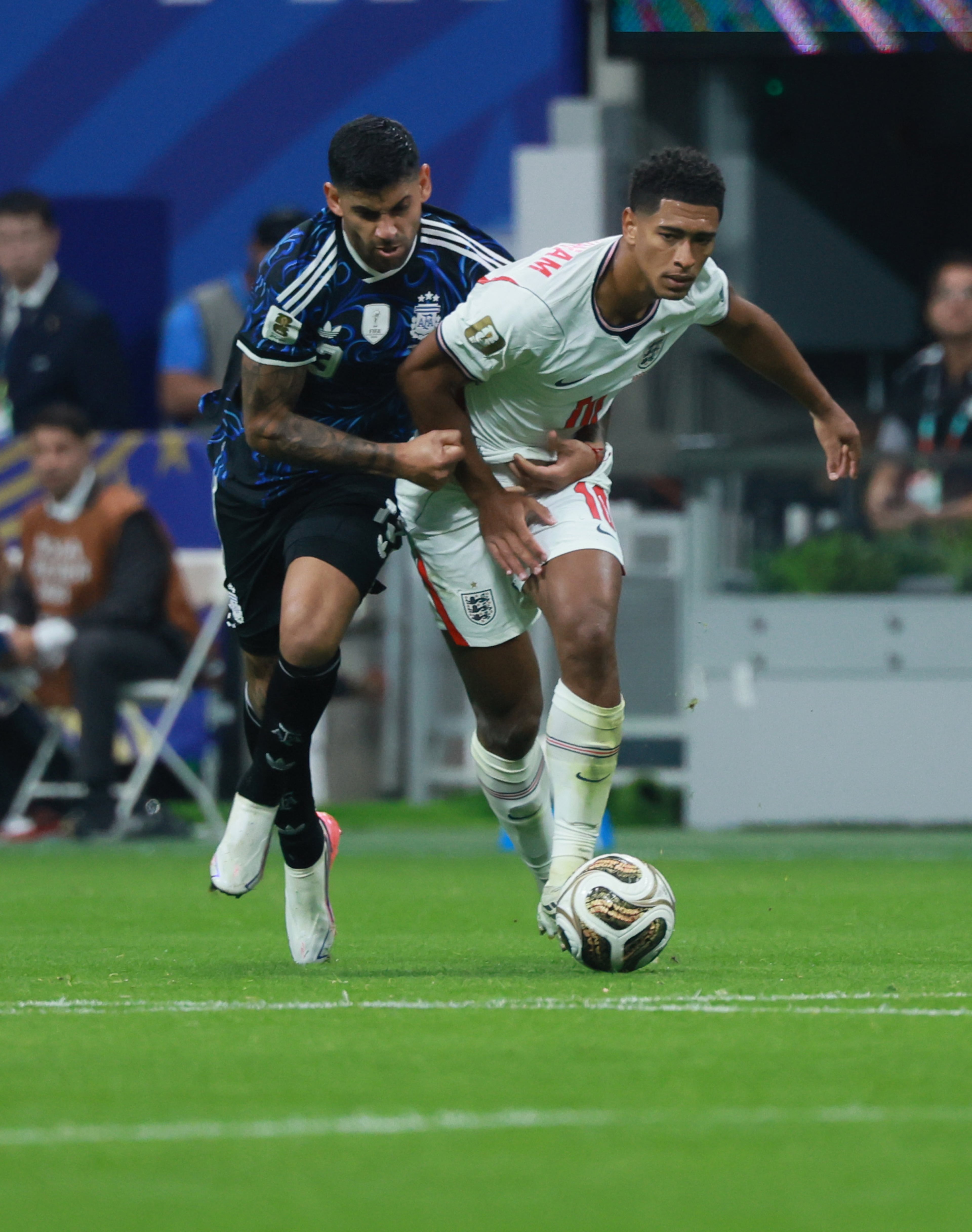 Argentina's Cristian Romero, left, wraps up England's Jude Bellingham during second half of Argentina vs. England FIFA World Cup Semifinal match at Atlanta Stadium (Mercedes-Benz Stadium) on Wednesday, July 15, 2026. (Jason Getz/AJC)