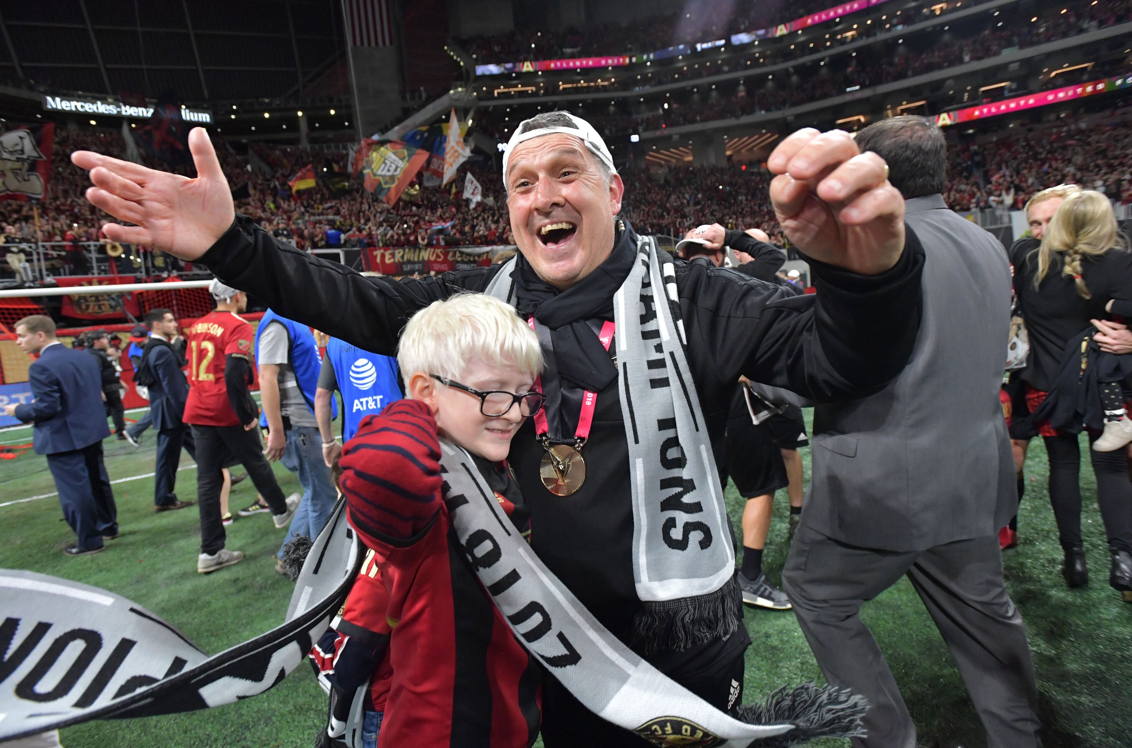 12/8/18 - Atlanta - Atlanta United Coach Gerardo Martino celebrates on the field after the victory. The Atlanta United soccer team defeated the Portland Timbers for the MLS Cup, the championship game of the Major League Soccer League at Mercedes-Benz Stadium in Atlanta. HYOSUB SHIN / HSHIN@AJC.COM
