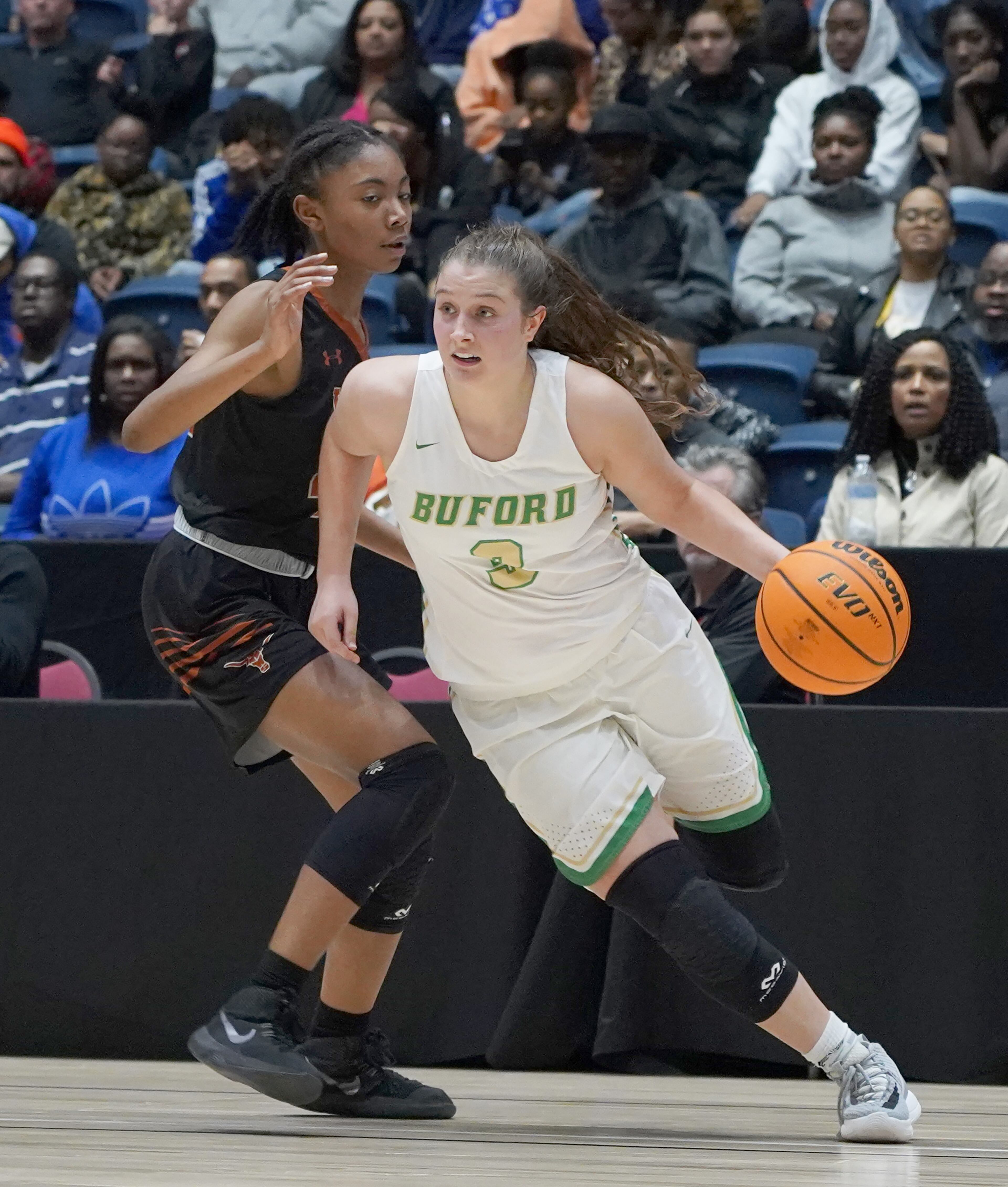Buford's Tate Walters (3) drives around Kell's Amaya Moss in the second half at the Class AAAA girls title basketball game at the Macon Centreplex, Friday March 6, 2020, in Macon. Tami Chappell for the Atlanta Journal Constitution