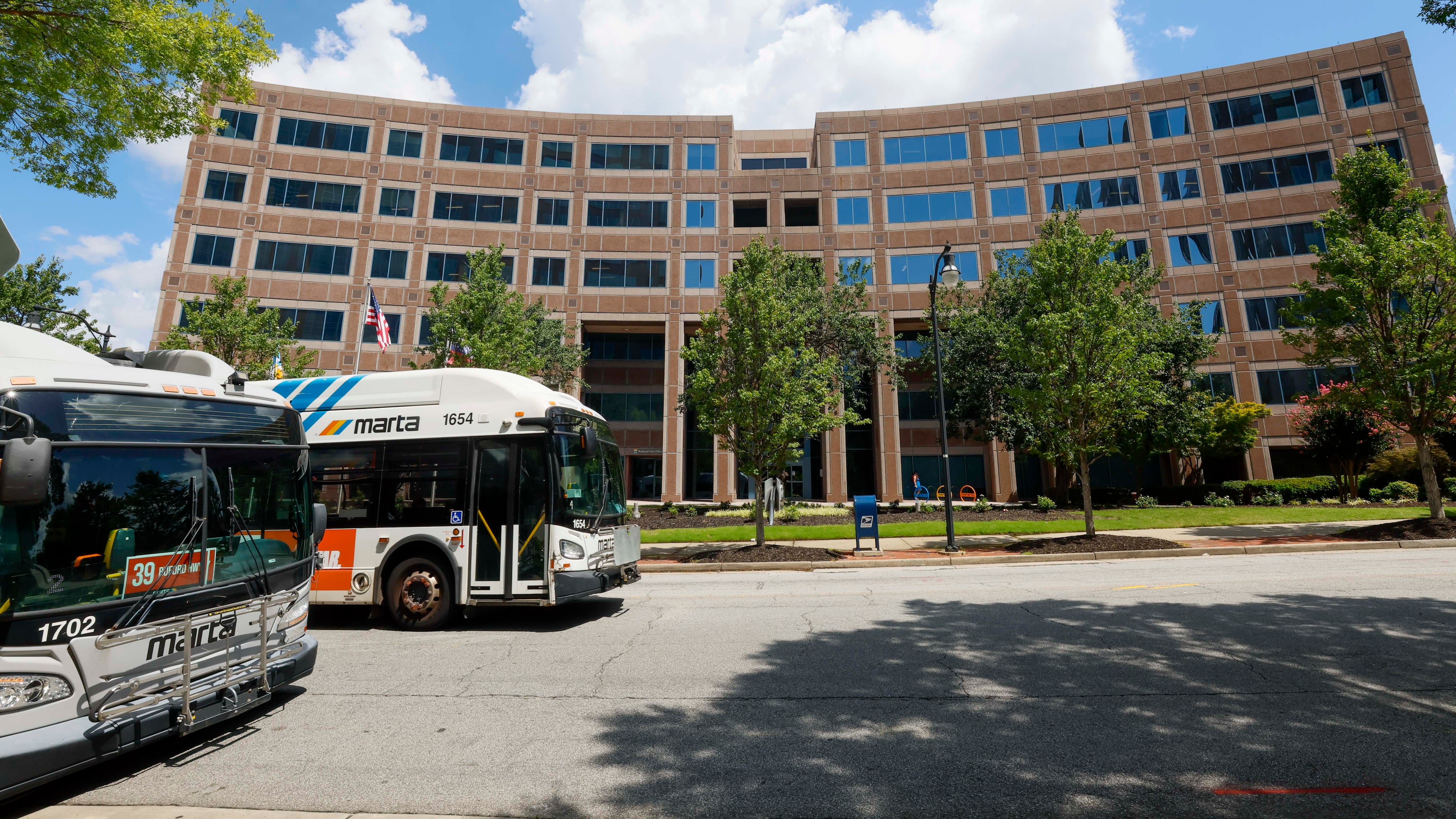 A MARTA bus drives past MARTA headquarters on Piedmont Road NE in Atlanta near the Lindbergh Center rail station on Sunday, Aug. 9, 2026. (Miguel Martinez/AJC)