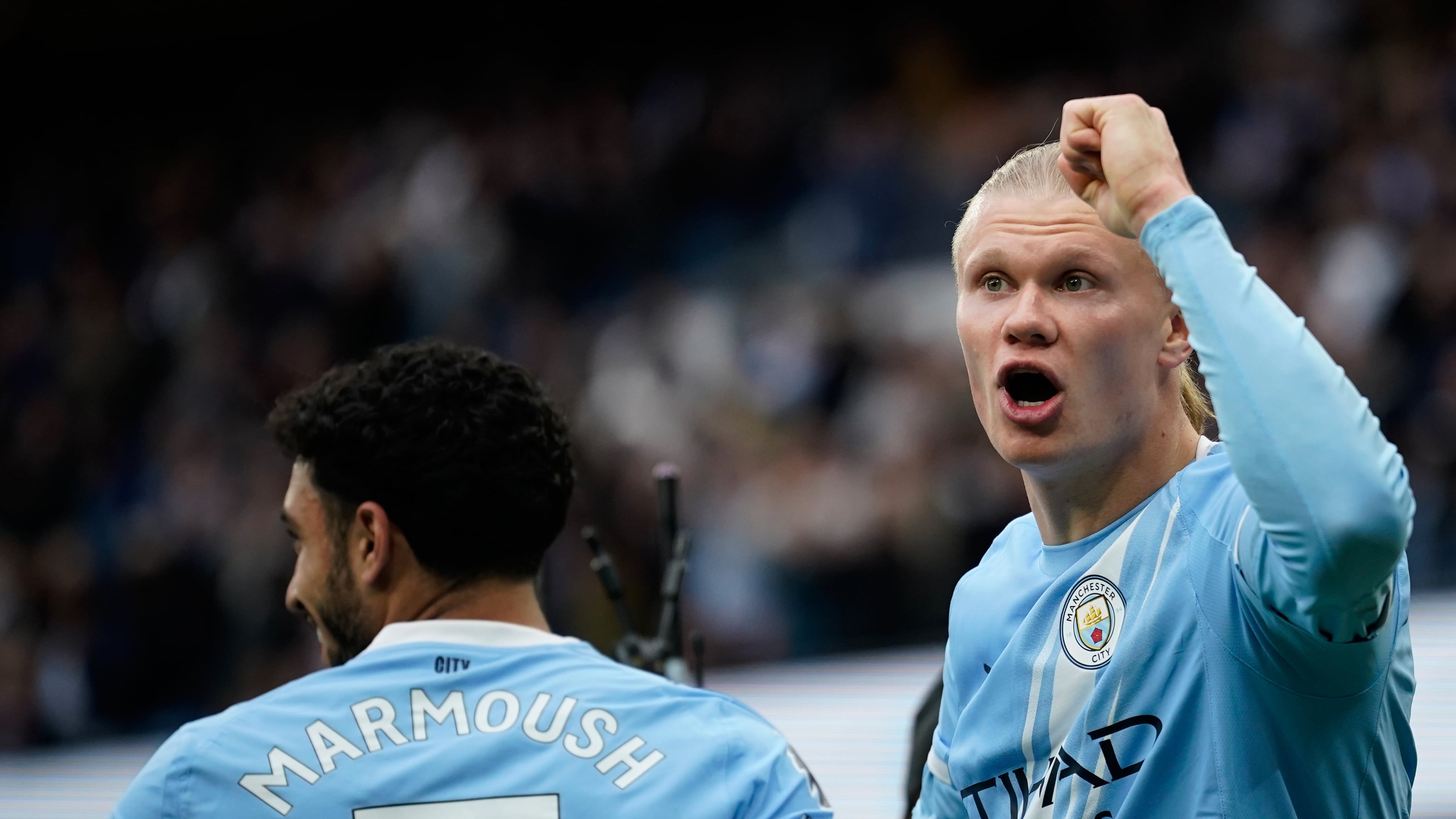 Manchester City's Erling Haaland, right, celebrates with Manchester City's Omar Marmoush after scoring his side's opening goal during the English Premier League soccer match between Manchester City and Brentford in Manchester, Saturday, May 9, 2026. (AP Photo/Dave Thompson)