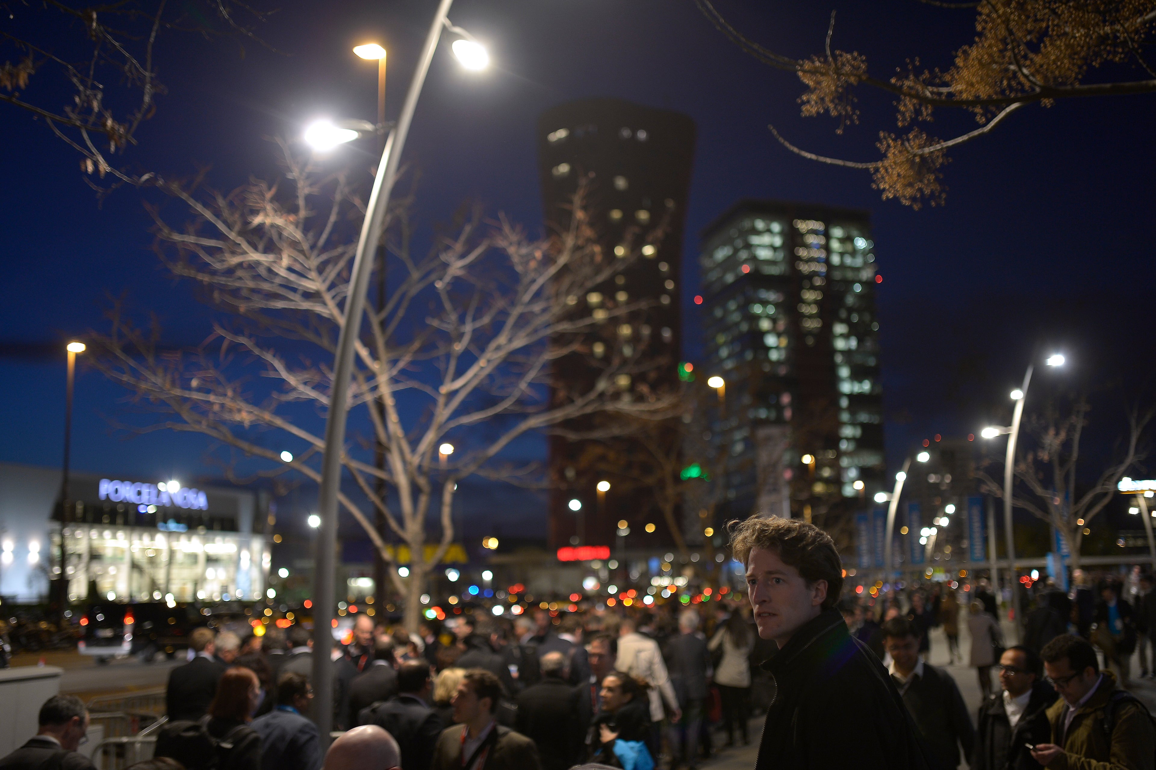 Visitors wait in line for a taxi outside at the Mobile World Congress, the world's largest mobile phone trade show in Barcelona, Spain, Tuesday, Feb. 25, 2014. (AP Photo/Manu Fernandez)