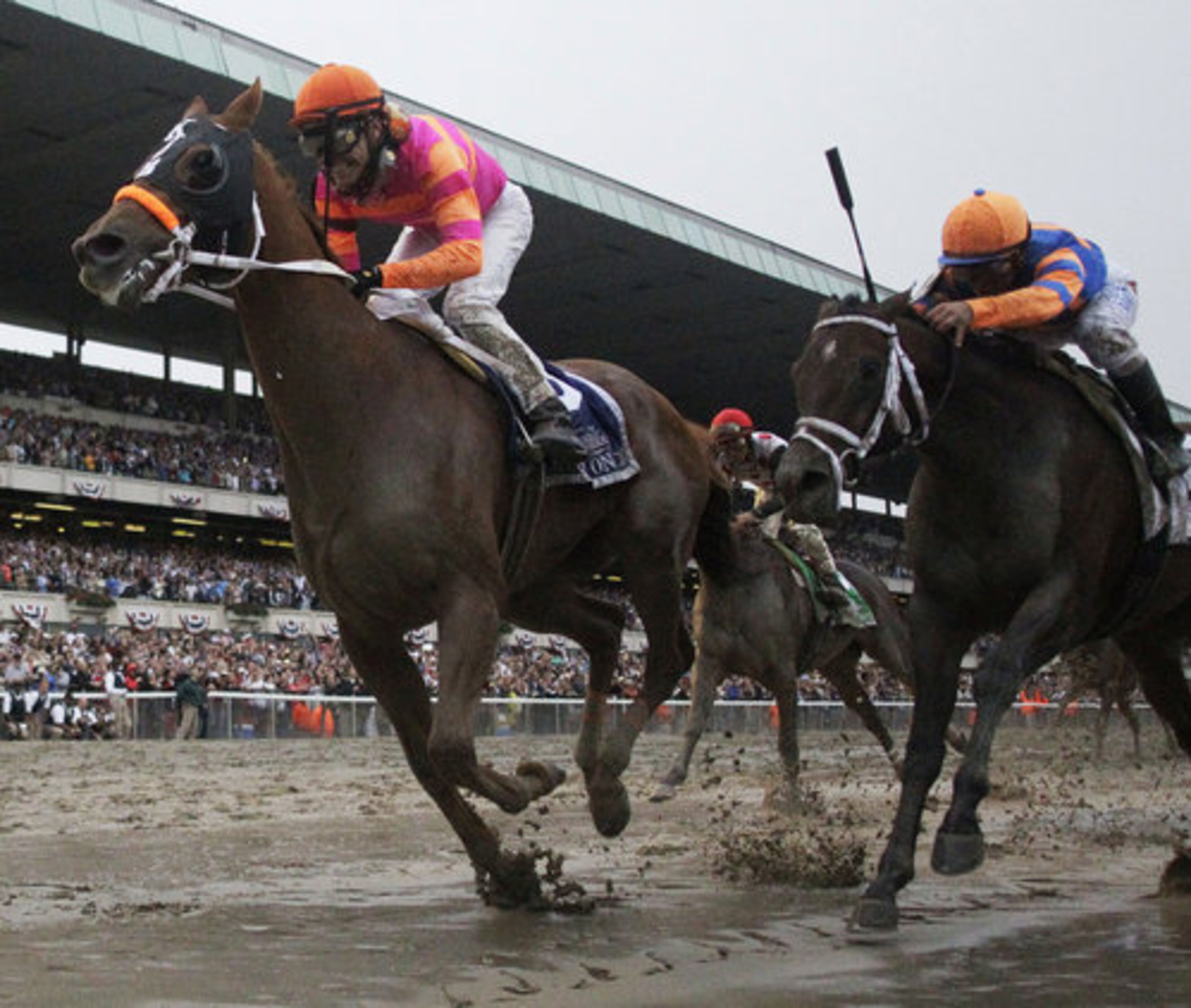 Ruler On Ice, left, with jockey Jose Valdivia Jr., sprints ahead of jockey Javier Castellano on Stay Thirsty to win the Belmont Stakes horse race Saturday, June 11, 2011, at Belmont Park in Elmont, N.Y.