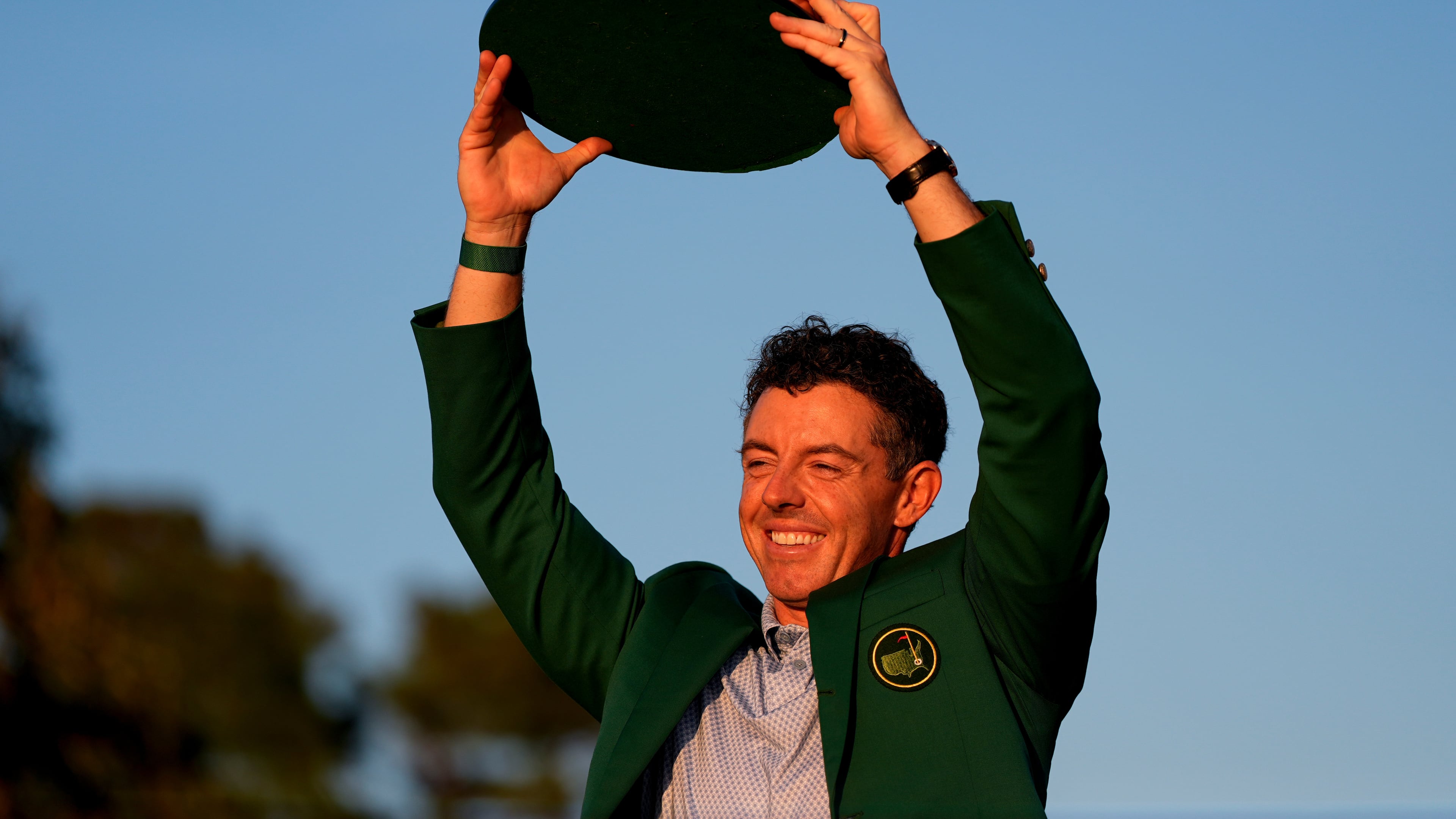 Rory McIlroy, of Northern Ireland, holds the trophy after winning the Masters golf tournament at the Augusta National Golf Club, Sunday, April 12, 2026, in Augusta, Ga.(AP Photo/Ashley Landis)