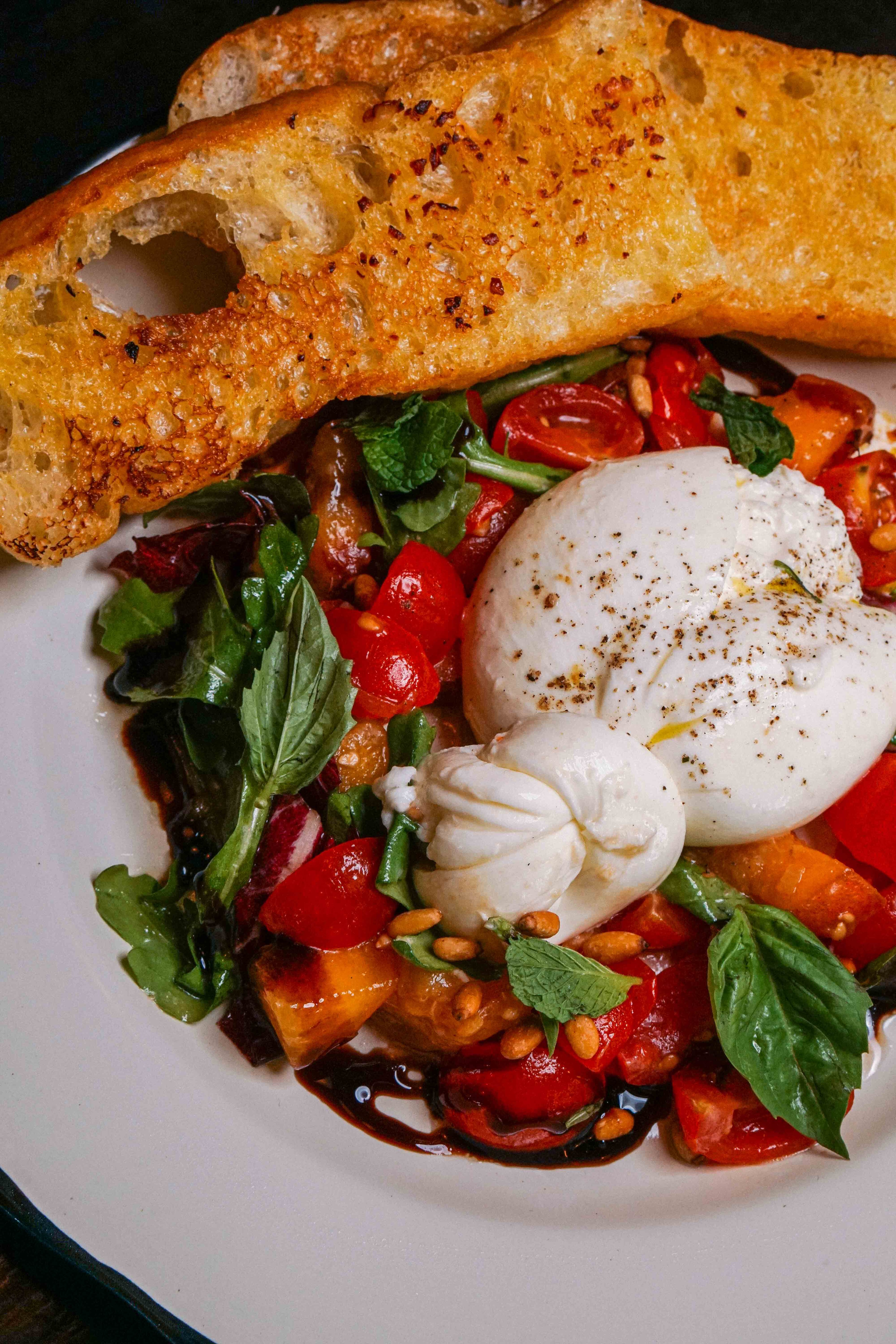 A summery burrata salad at Besto. (Drew Perlmutter/Courtesy of Besto)