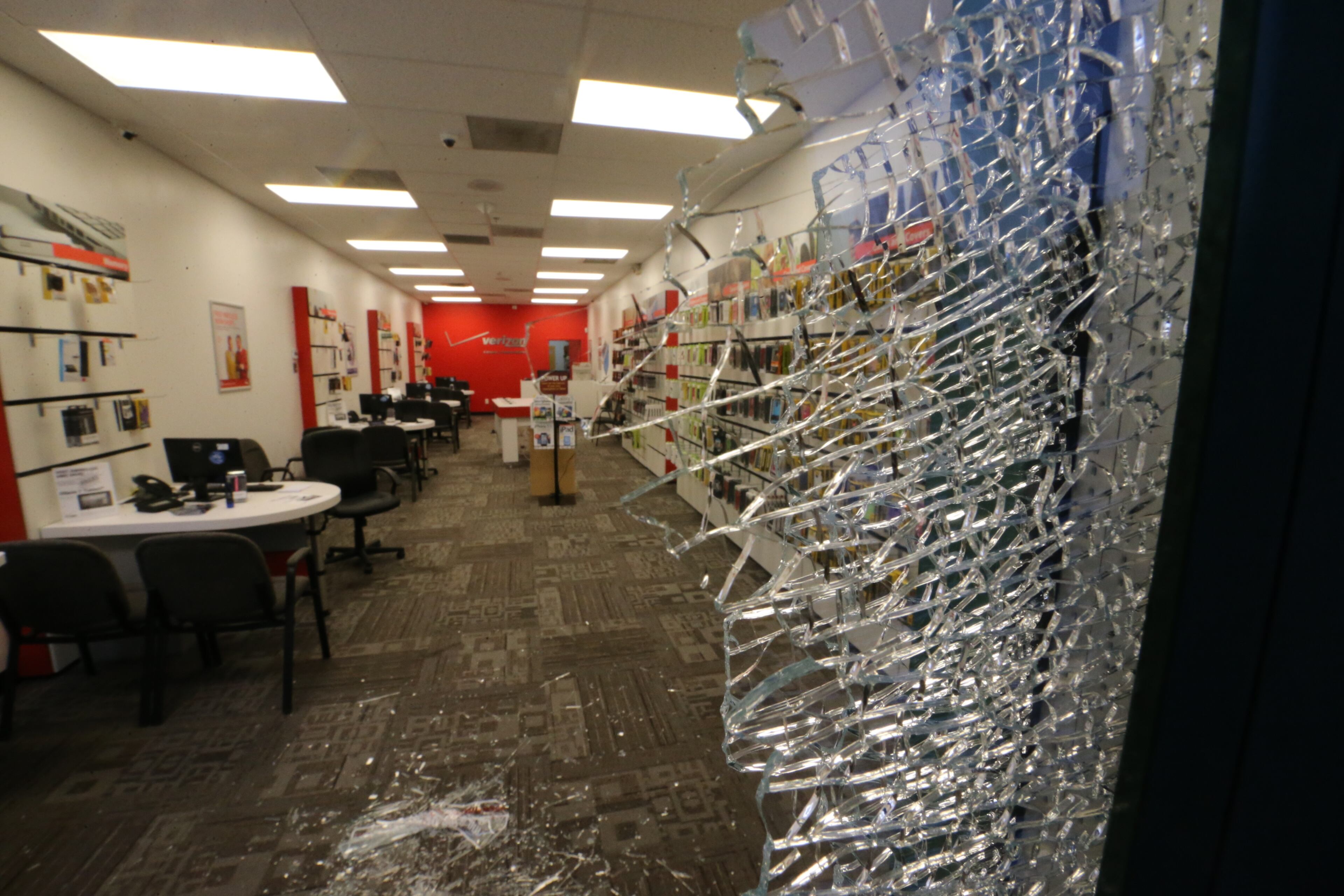 Smash-and-grab burglars hit a Cobb County cell phone store before daybreak Tuesday, making off with several thousand dollars worth of phones, but a store official said the loss could have been much worse. JOHN SPINK/JSPINK@AJC.COM