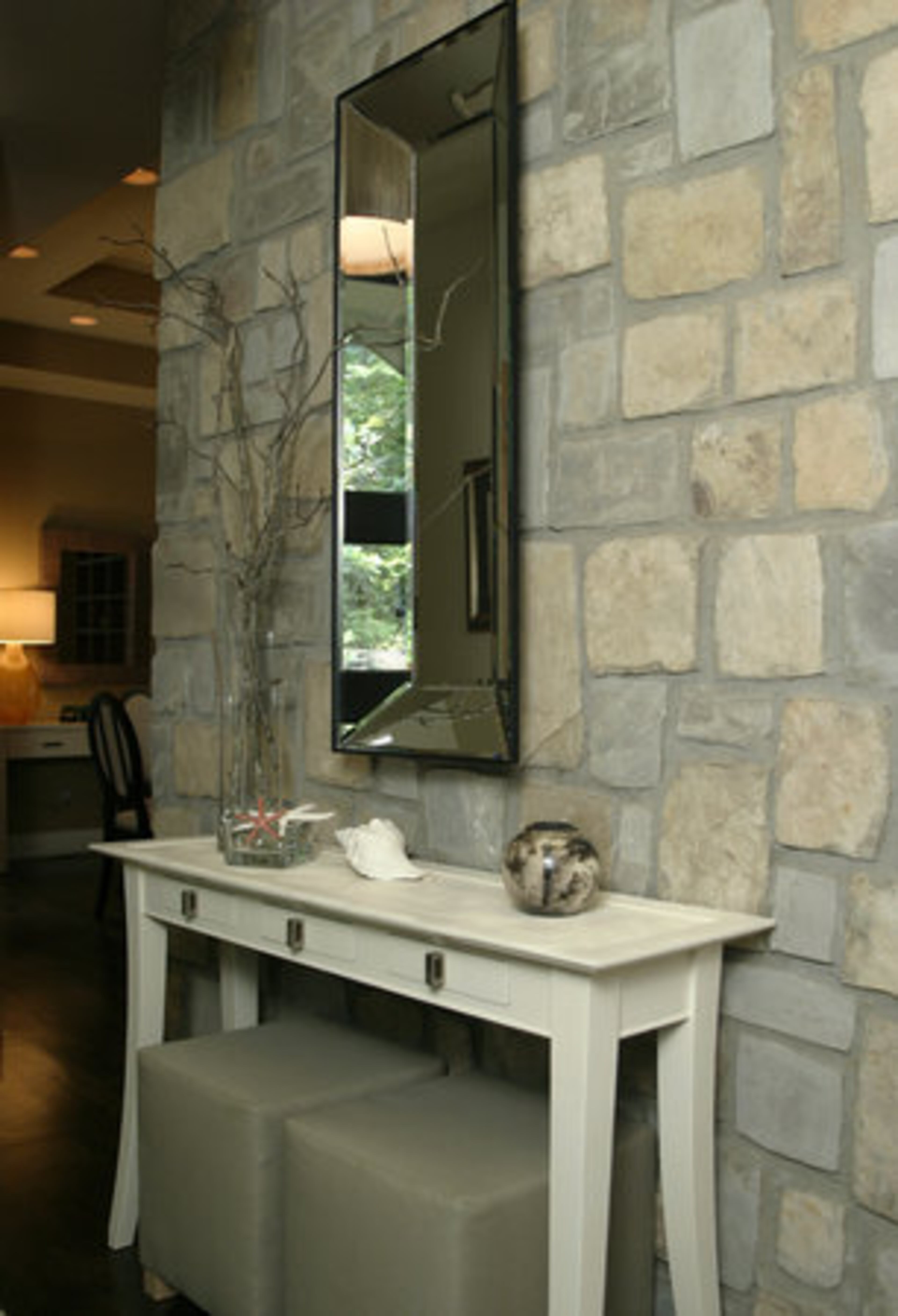 The couple incorporated natural stone into the foyer and throughout their home.