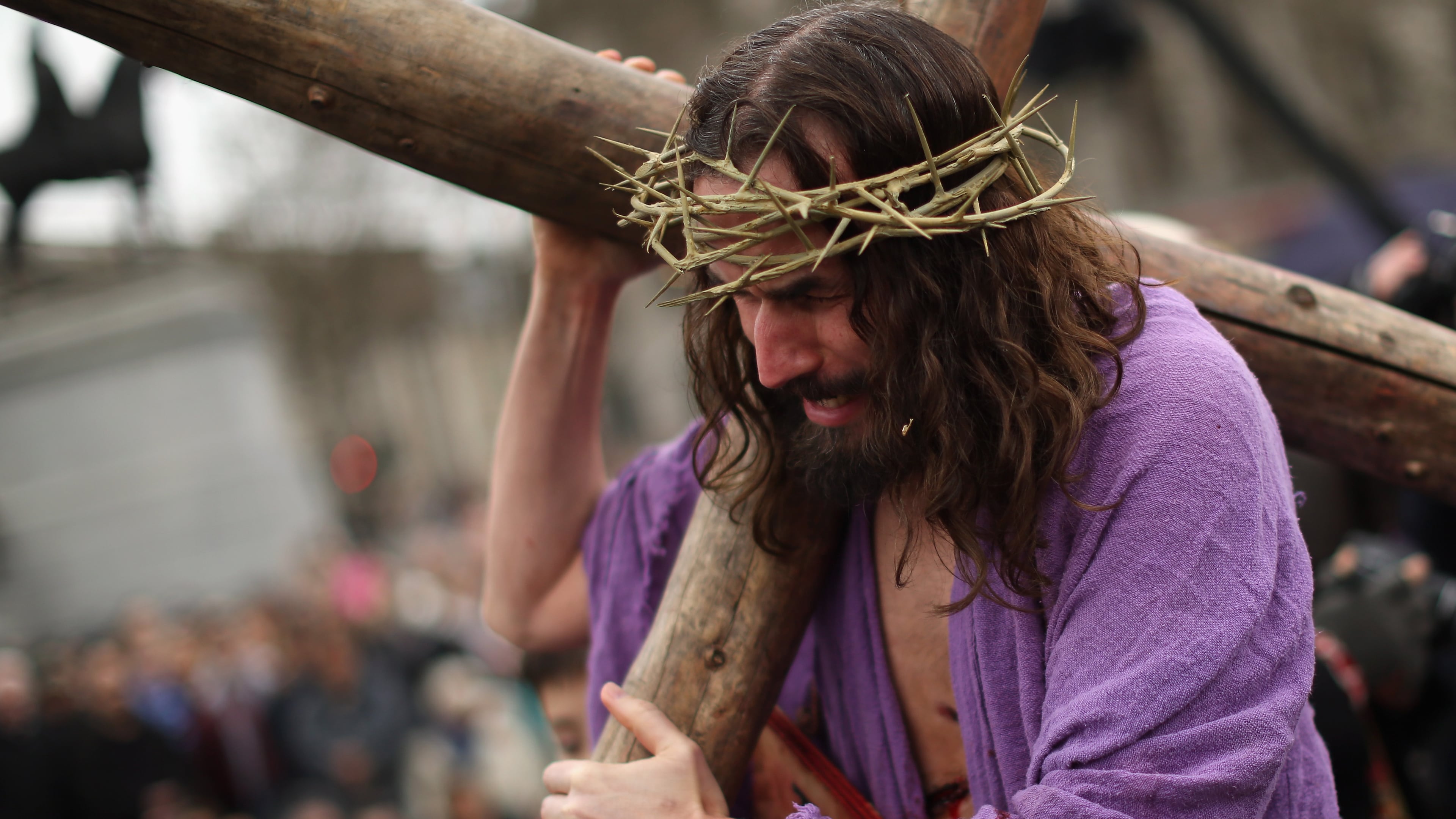 LONDON, ENGLAND - APRIL 03: Actor James Burke-Dunsmore playing Jesus drags the cross during the Wintershall's 'The Passion of Jesus' production on Good Friday in Trafalgar Square on April 3, 2015 in London, England. Good Friday is a Christian religious holiday before Easter Sunday, which commemorates the crucifixion of Jesus Christ on the cross. The Wintershall's theatrical production of 'The Passion of Jesus' includes a cast of 100 actors, horses, a donkey and authentic costumes of Roman soldiers in the 12th Legion of the Roman Army. (Photo by Dan Kitwood/Getty Images)