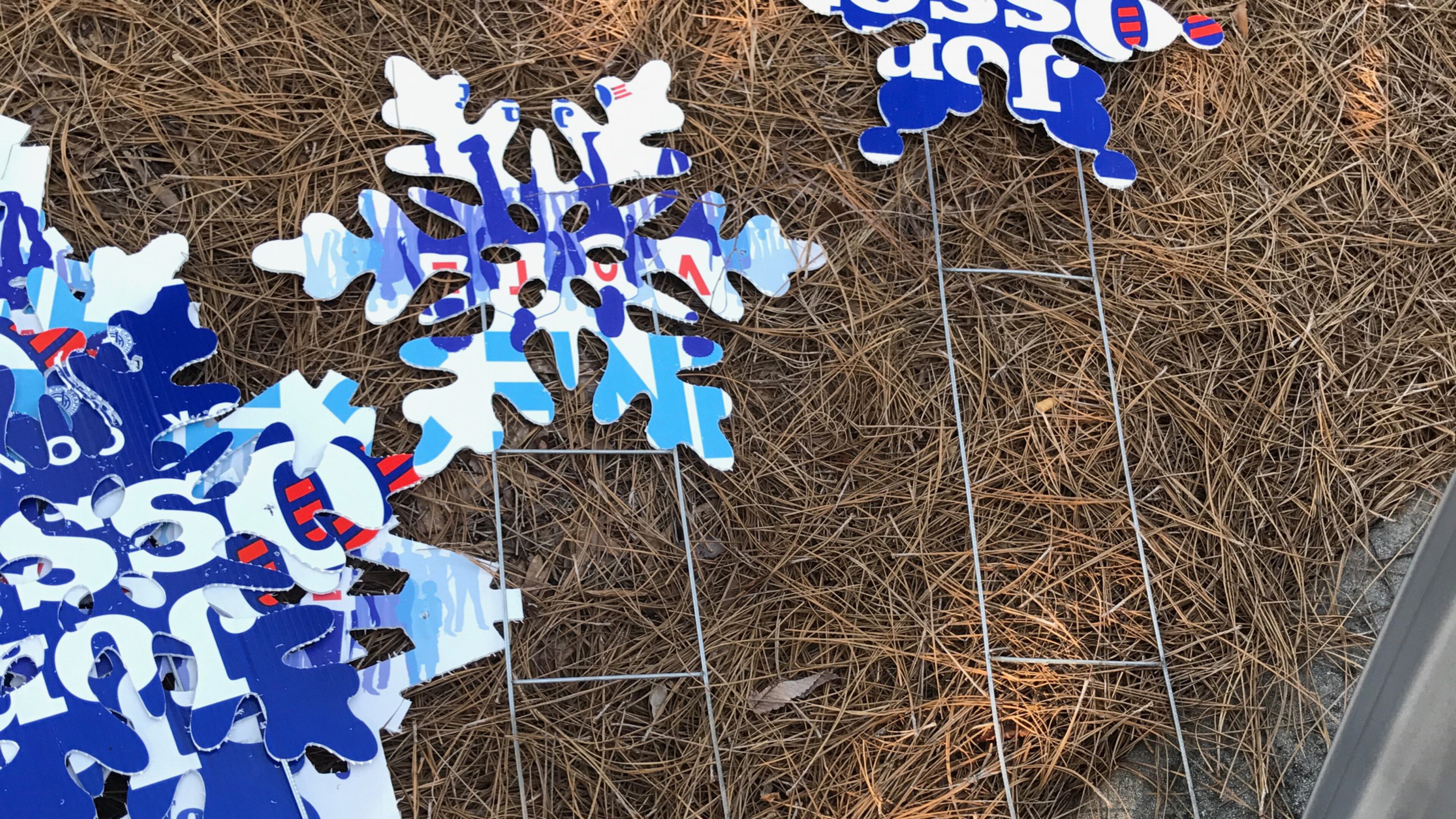 Campaign signs for Karen Handel and Jon Ossoff were cut into snowflakes and placed around Dunwoody.