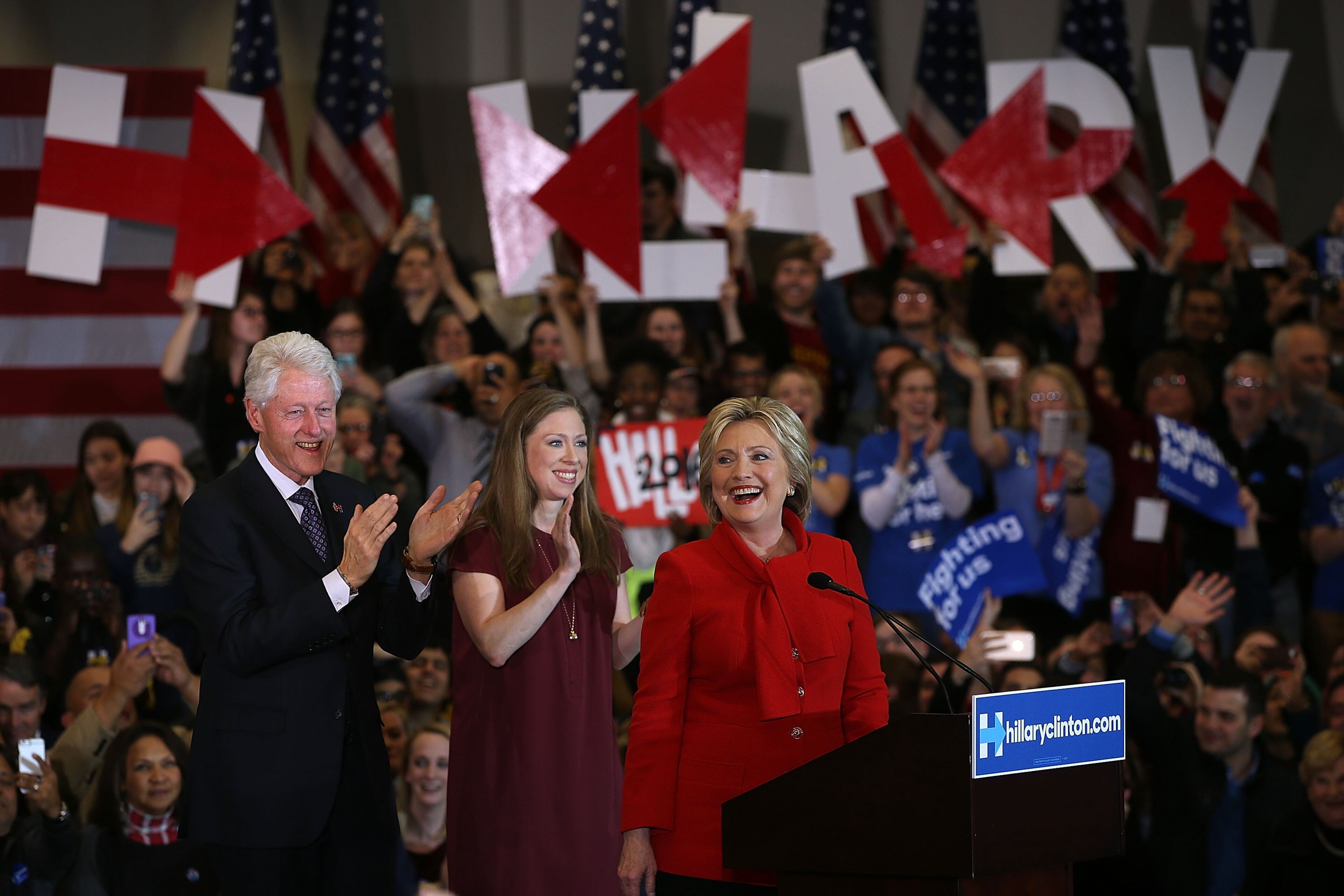 Democratic presidential candidate former Secretary of State Hillary Clinton speaks to supporters as Former U.S. president Bill Clinton and daughter Chelsea Clinton look on during her caucus night event in the Olmsted Center at Drake University on February 1, 2016 in Des Moines, Iowa. Clinton is competing with Sen. Bernie Sanders (I-VT) in the Iowa Democratic caucus. (Photo by Justin Sullivan/Getty Images)