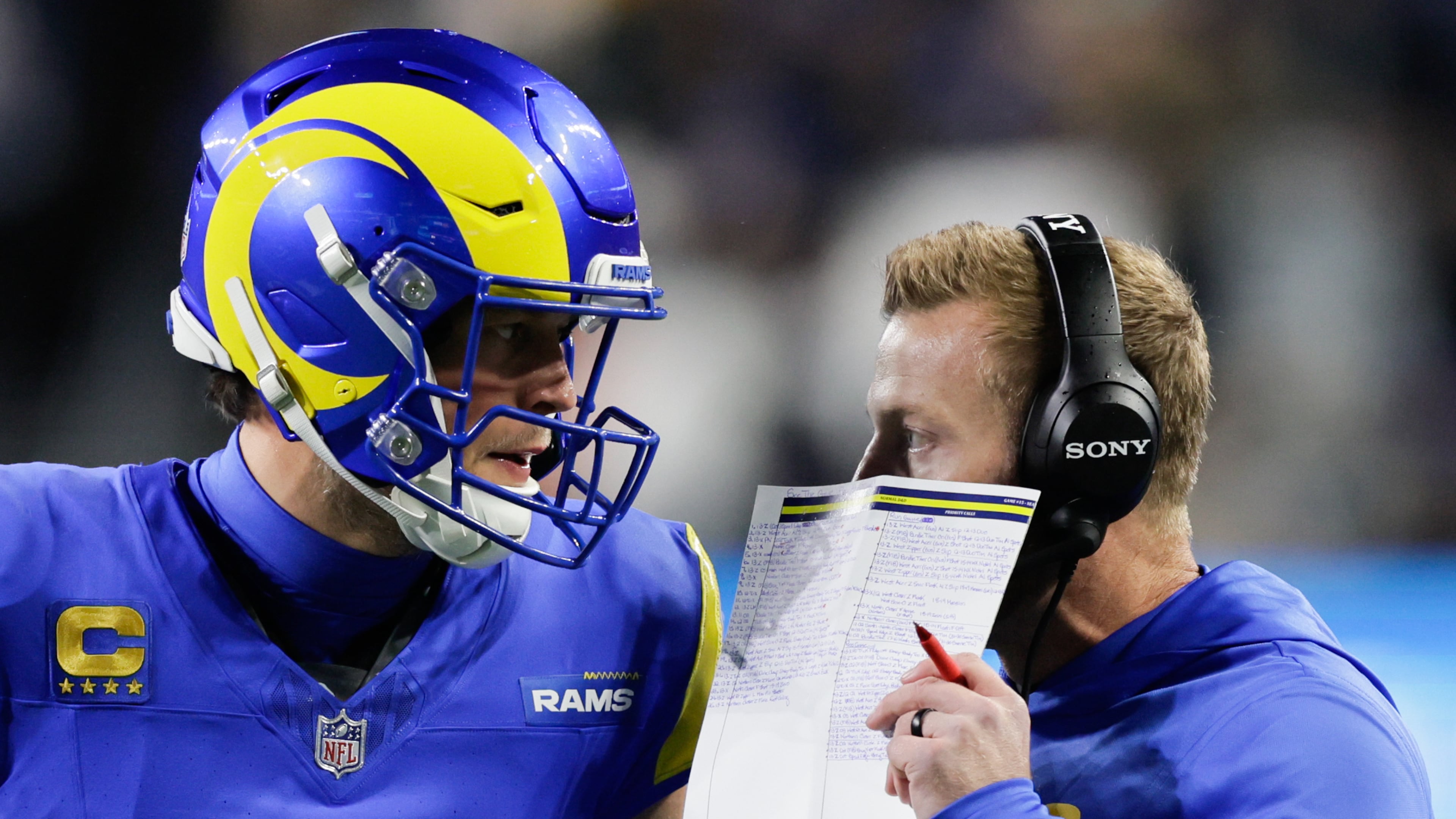 Los Angeles Rams head coach Sean McVay talks with quarterback Matthew Stafford, left, during the first half of an NFL football game Thursday, Dec. 18, 2025, in Seattle. (John Froschauer/AP)