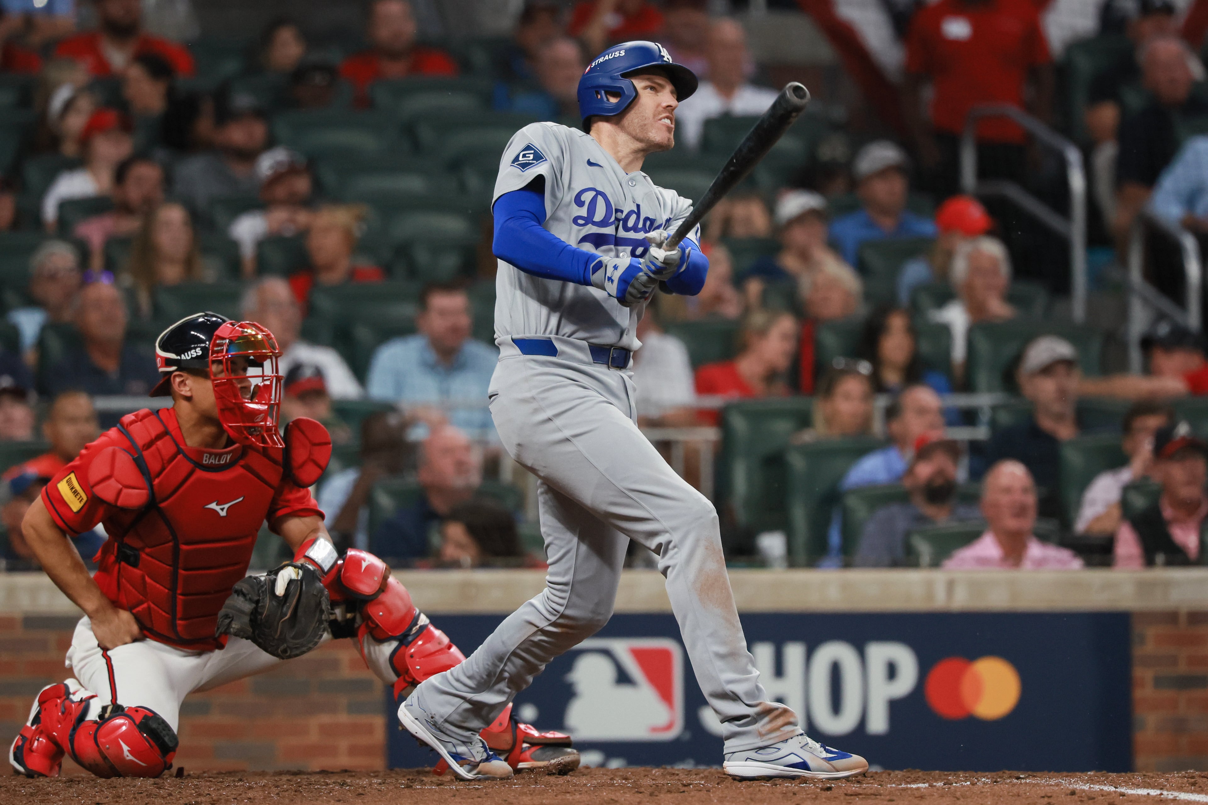 Los Angeles Dodgers first baseman Freddie Freeman (5) hits a solo home run against the Atlanta Braves during the fourth inning of Game 3 of the MLB National League Division Series between the Atlanta Braves and the Los Angeles Dodgers, Tuesday, Oct. 6, 2026, in Atlanta. (Jason Getz/AJC)