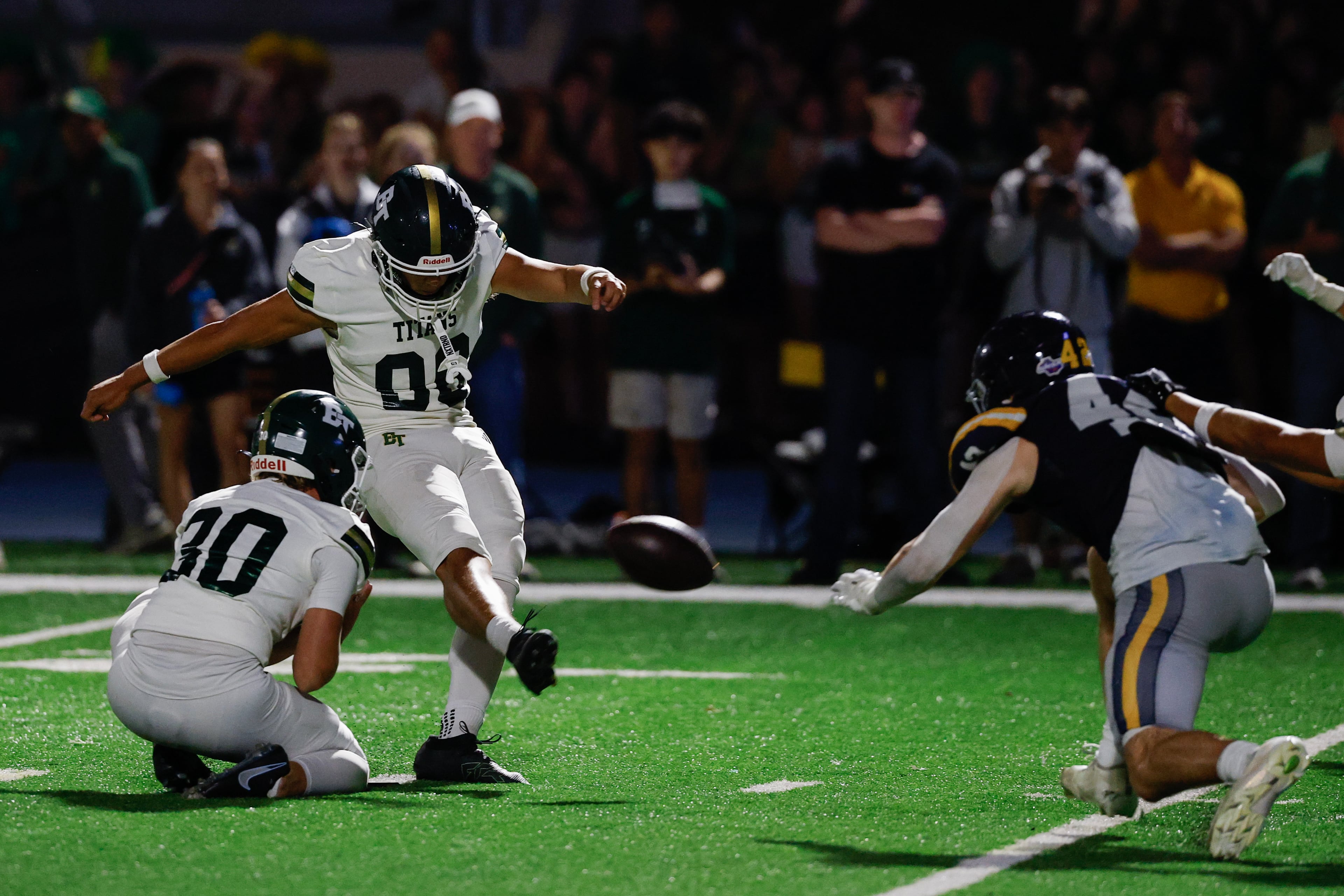 Marist's Owen Hare (right) attempts to block a kick by Blessed Trinity's Richard Morthland during the second half a high school football game between Blessed Trinity and Marist, Friday, Sept. 25, 2026, in Atlanta. (Erik S. Lesser for the AJC)
