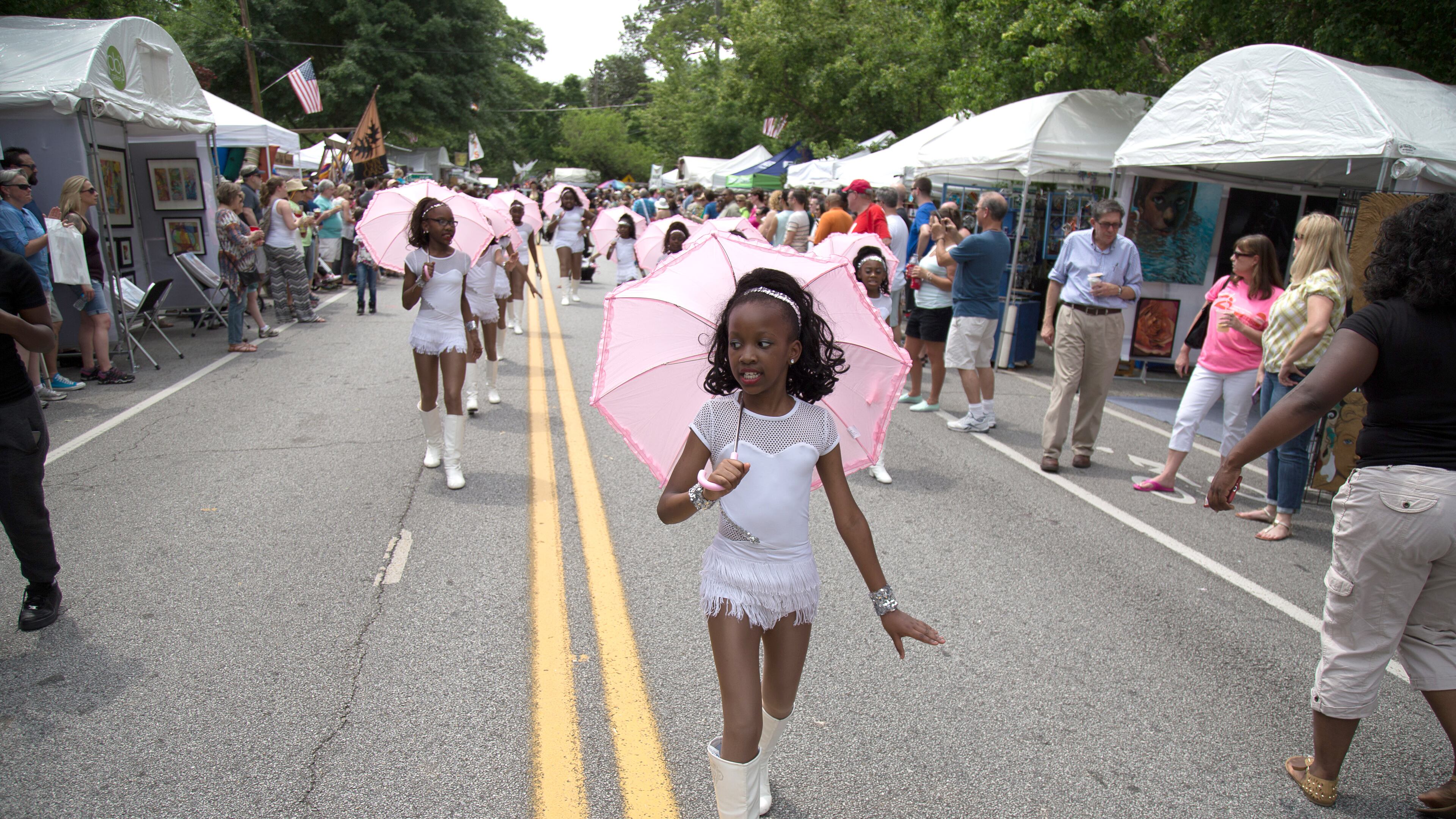 Dancers from the Gems of Georgia Dance Team march down the parade route during the Inman Park Festival Parade in Atlanta on Saturday April 30, 2016. STEVE SCHAEFER / SPECIAL TO THE AJC