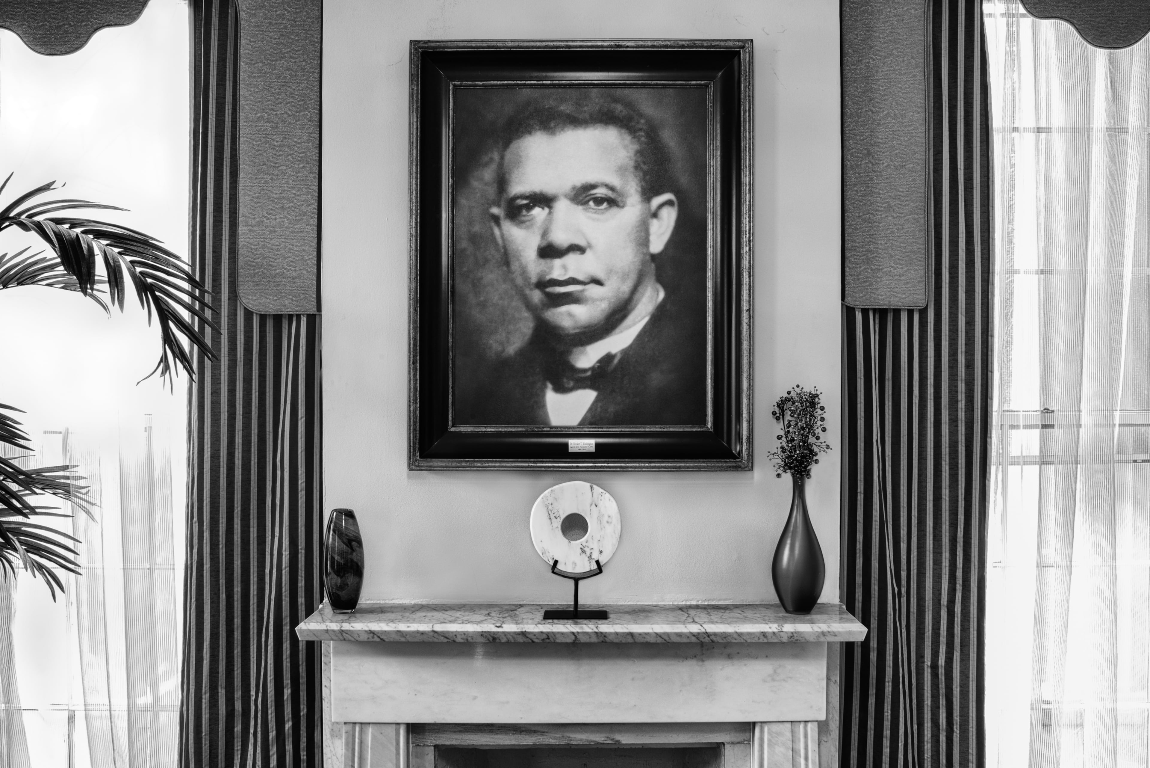Booker T. Washington, educator, was friends with Julius Rosenwald, and convinced him to join the board of the Tuskegee Institute, and help build schools for Black children in the South. This photo of Washington hangs at the residence of the Tuskegee University president. Photo: Andrew Feiler