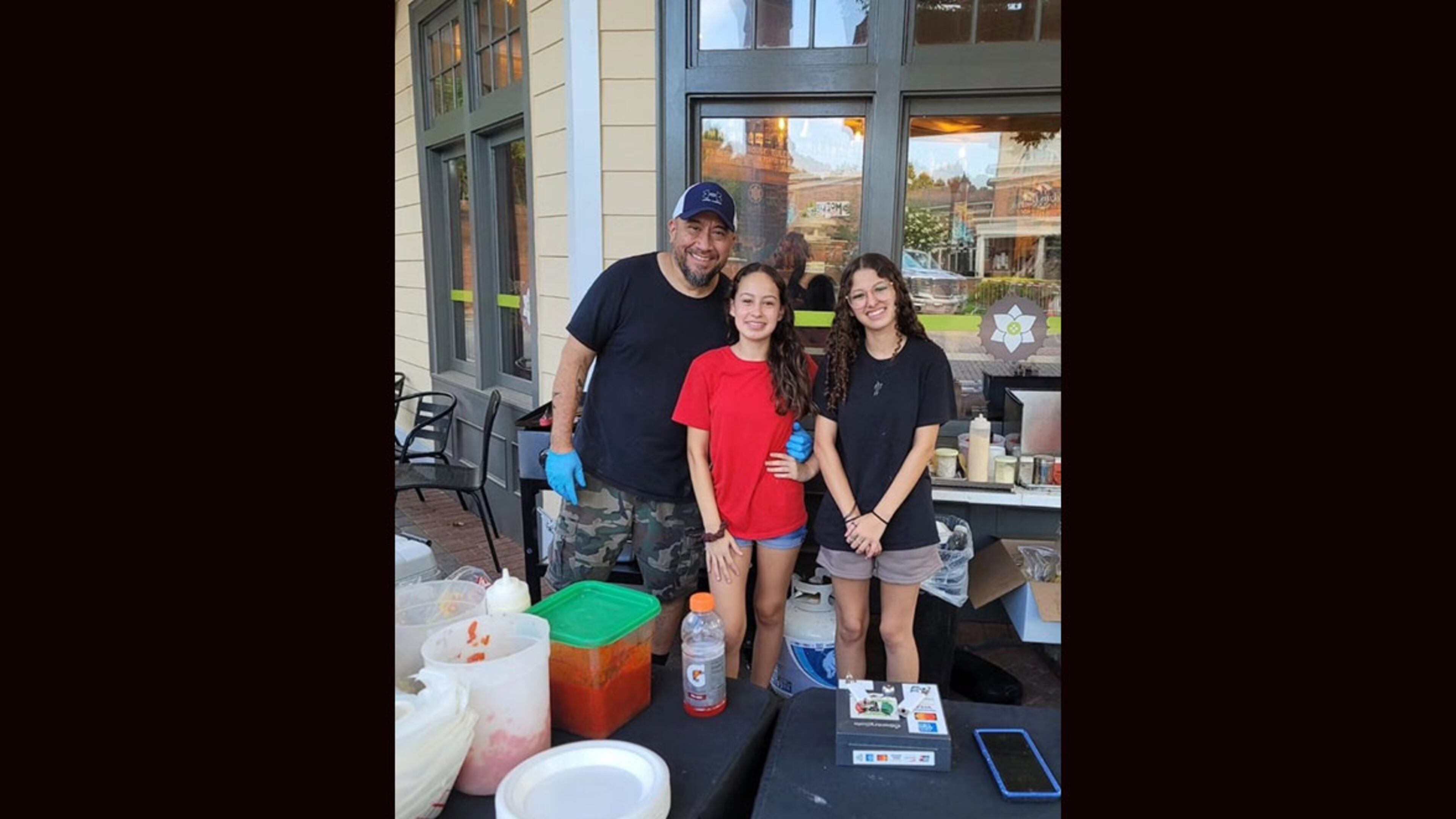 Jose Laos (from Left) and his daughters Caylee and Alexis are behind the Atlanta pop-up Jose's Birria Local. / Courtesy of Jose's Birria Local
