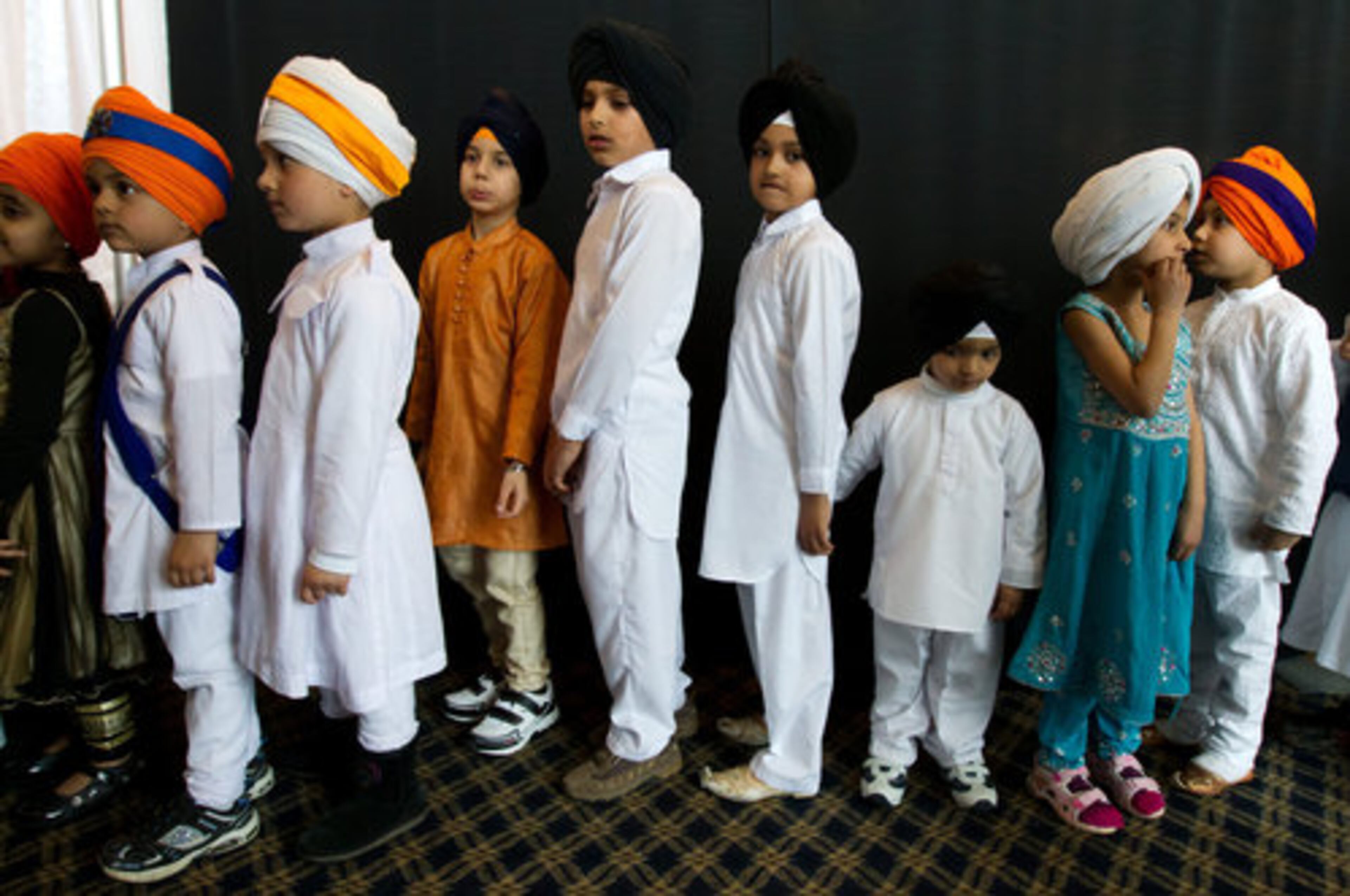 MY TURBAN IS COOLER THAN YOURS! Children line up as they wait to go on stage during a turban competition in Surrey, British Columbia, Canada, on Sunday April 10, 2011. Prizes were awarded for the biggest turban, best tying style and longest braid at the 9th annual event which organizers say is the largest in North America.