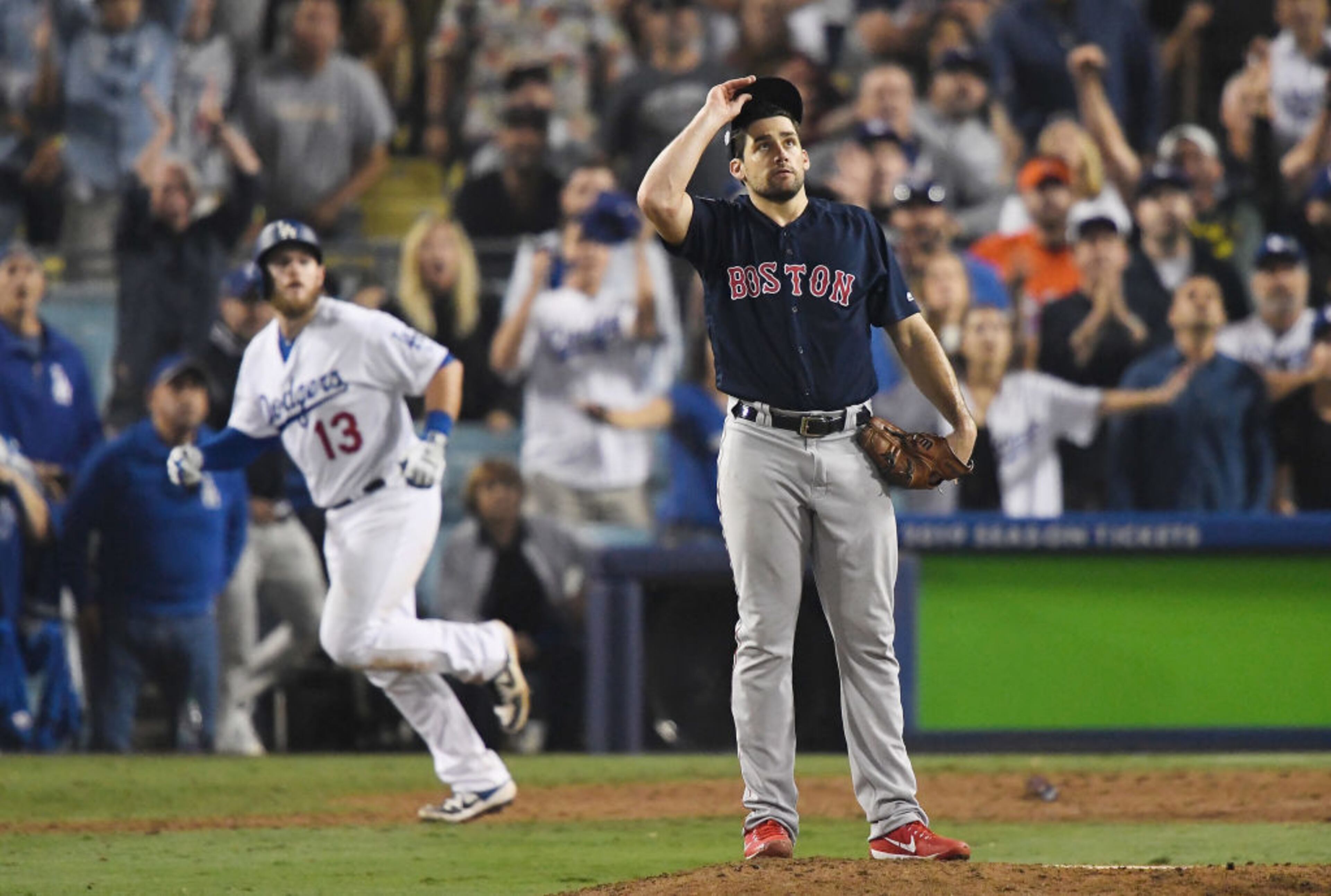 LOS ANGELES, CA - OCTOBER 26: Nathan Eovaldi #17 of the Boston Red Sox watches the ball leave the park as Max Muncy #13 of the Los Angeles Dodgers hits and eighteenth inning walk-off home run to win the game 3-2 in Game Three of the 2018 World Series at Dodger Stadium on October 26, 2018 in Los Angeles, California. (Photo by Kevork Djansezian/Getty Images)
