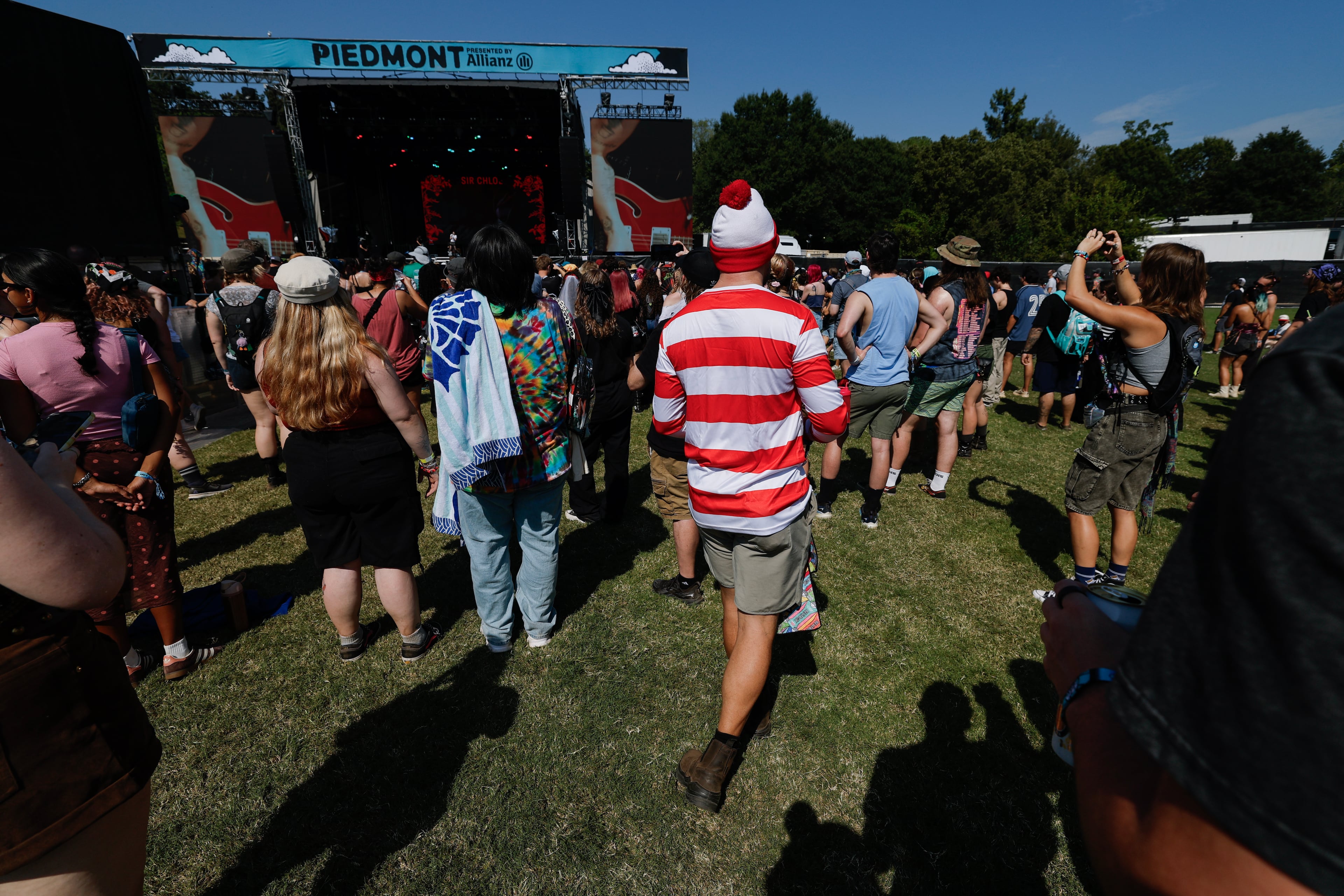 Where's Waldo listens to Sir Chloe perform during the Shaky Knees music festival at Piedmont Park, Saturday, Sept. 19, 2026, in Atlanta. (Erik S. Lesser for the AJC)