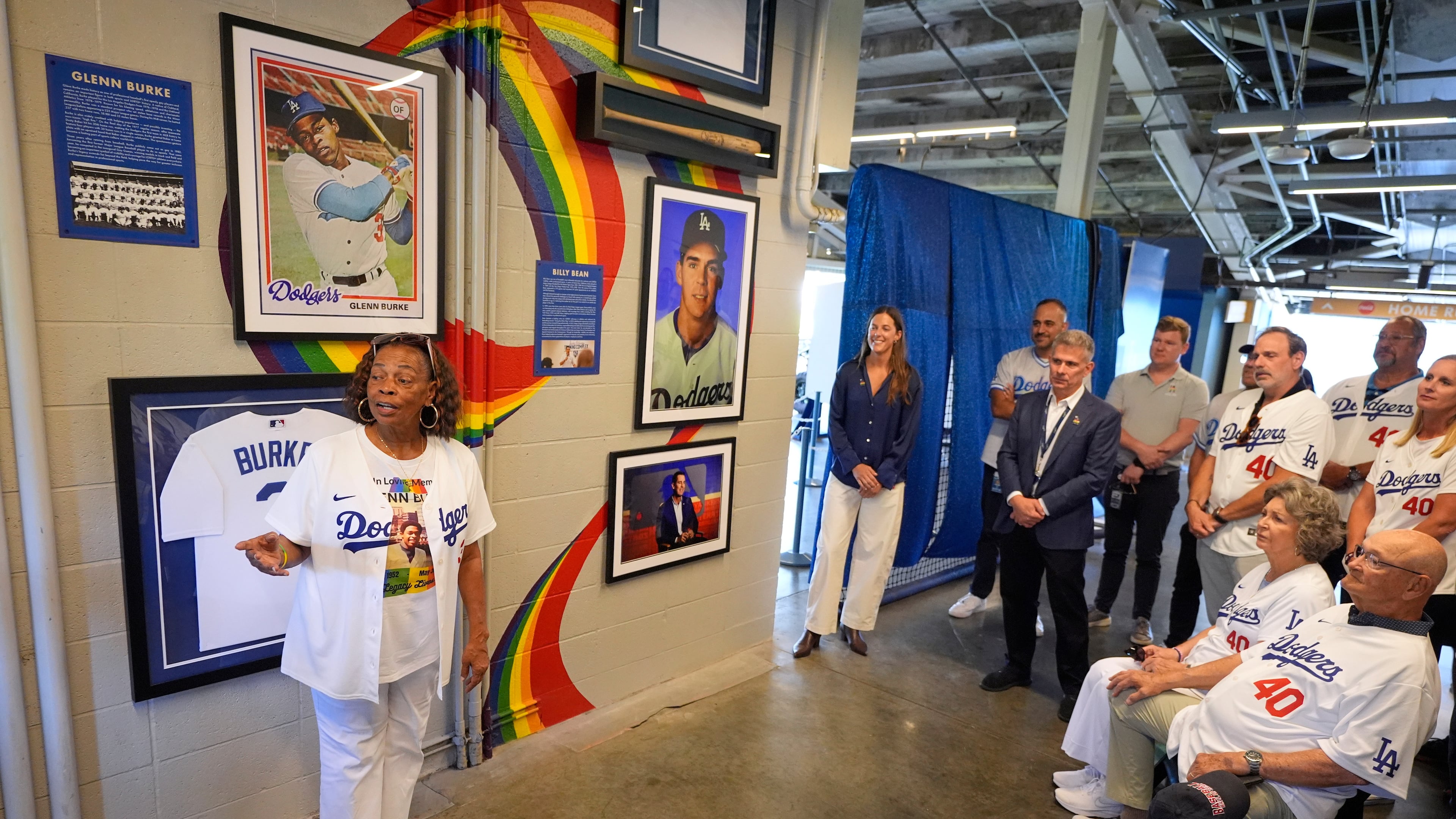 Joyce Henderson, left, sister of Glenn Burke, speaks during a ceremony prior to a baseball game to unveil a tribute to LGBTQ+ trailblazers and former Los Angeles Dodgers players Billy Bean and Burke, who were among the first professional athletes to identify as gay, Friday, June 5, 2026, in Los Angeles. (AP Photo/Mark J. Terrill)