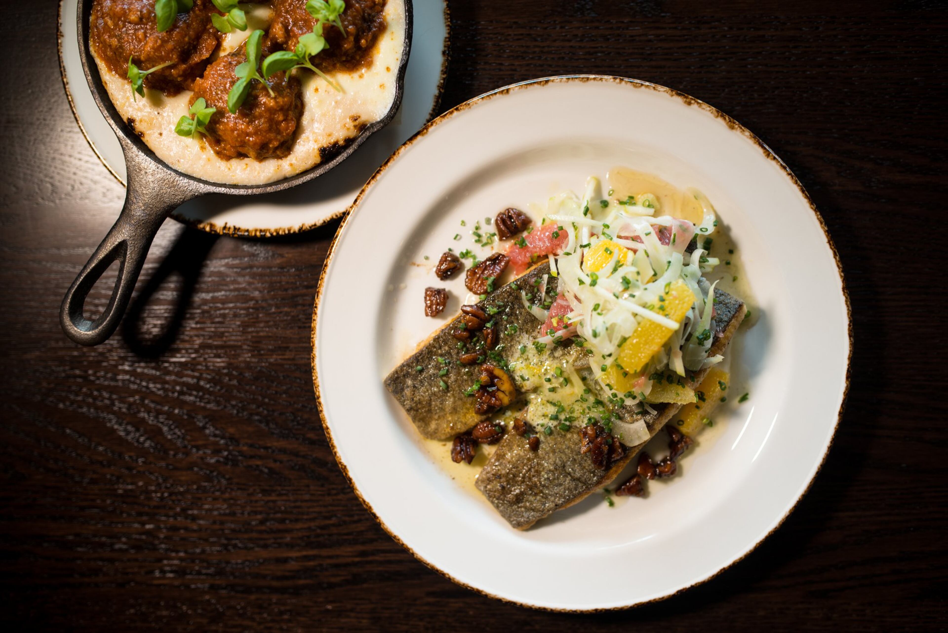 New Realm Brewing Rice Flour Crusted Trout and Spanish-style Tomato Braised Pork Meatballs. Photo credit- Mia Yakel.