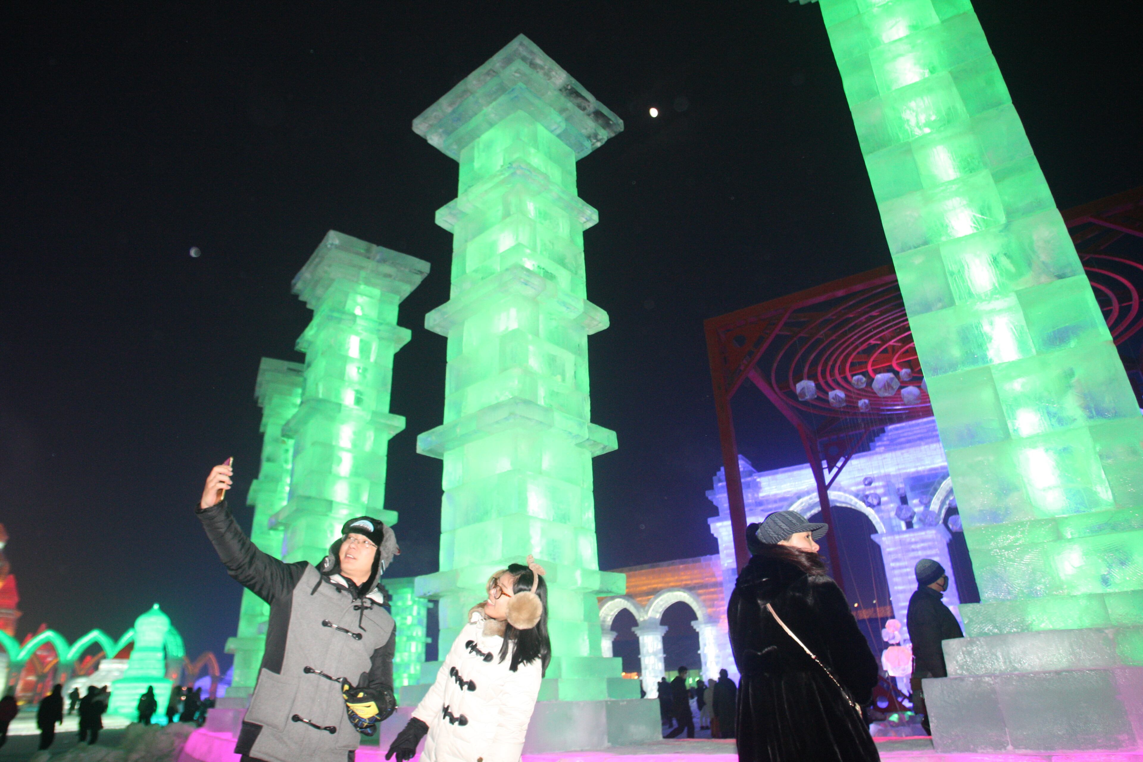 HARBIN, CHINA - DECEMBER 22: (CHINA OUT) Tourists visit the 17th Harbin Ice And Snow World during its test run on December 22, 2015 in Harbin, China. The event will run from December 25, 2015 to February 25, 2016. (Photo by ChinaFotoPress/ChinaFotoPress via Getty Images)