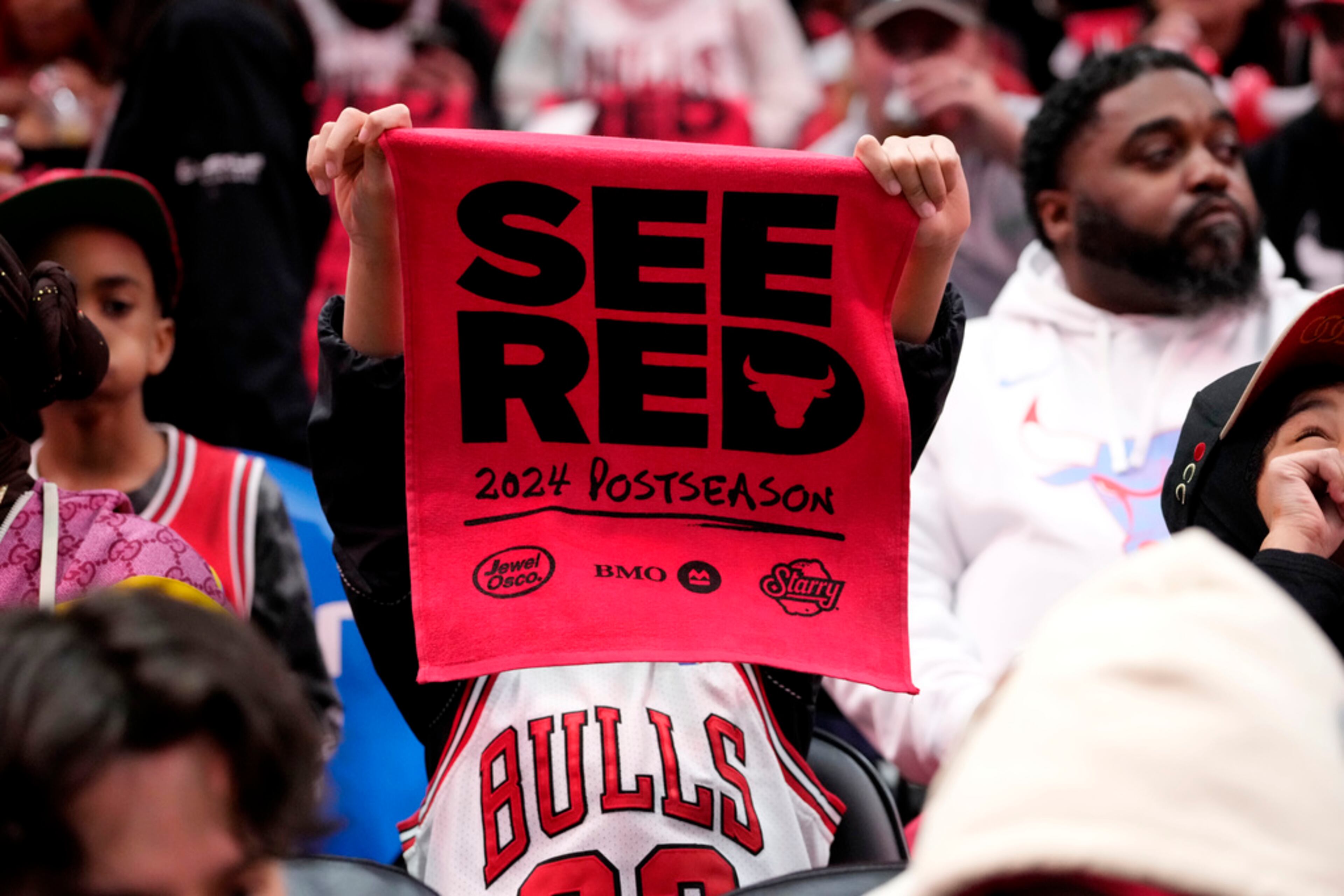 A Chicago Bulls fan cheers for his team before an NBA basketball play-in tournament game between the Atlanta Hawks and the Chicago Bulls in Chicago, Wednesday, April 17, 2024. (AP Photo/Nam Y. Huh)