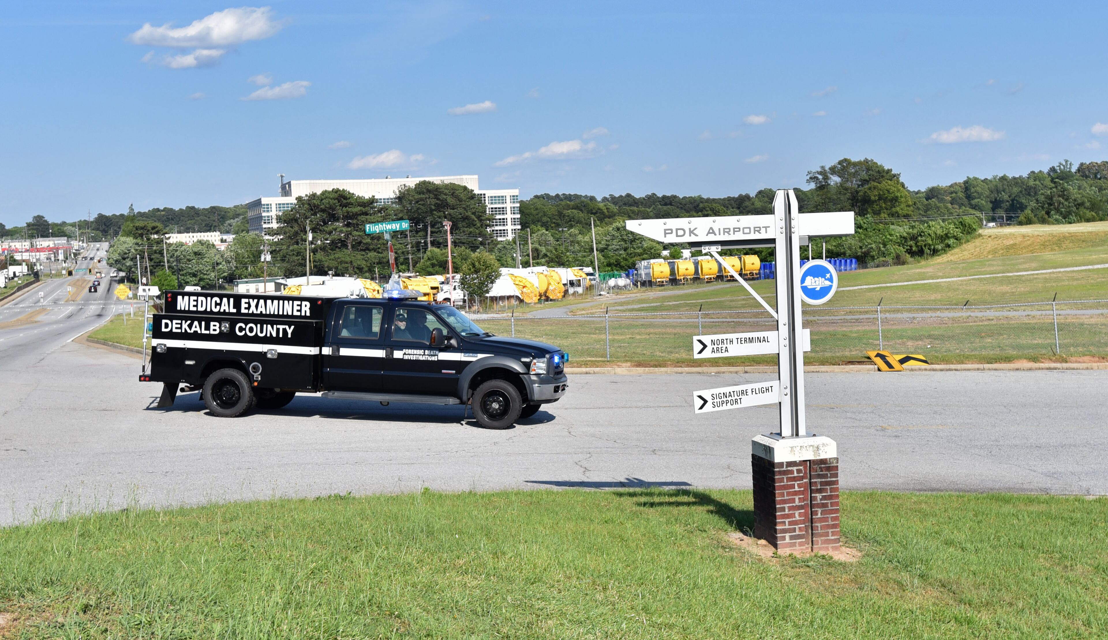 A DeKalb medical examiner vehicle rushes to the Peachtree-DeKalb Airport on Saturday afternoon, May 14, 2016. The pilot of a plane was killed when it crashed during an air show at Peachtree-DeKalb Airport, officials said. The crash occurred near the end of the Good Neighbor Day Air Show and Open House at PDK, about 4:49 p.m. The pilot was from the Augusta area, airport director Mario Evans said Saturday at a media briefing. His identity was not released, pending notification of next of kin. HYOSUB SHIN / HSHIN@AJC.COM