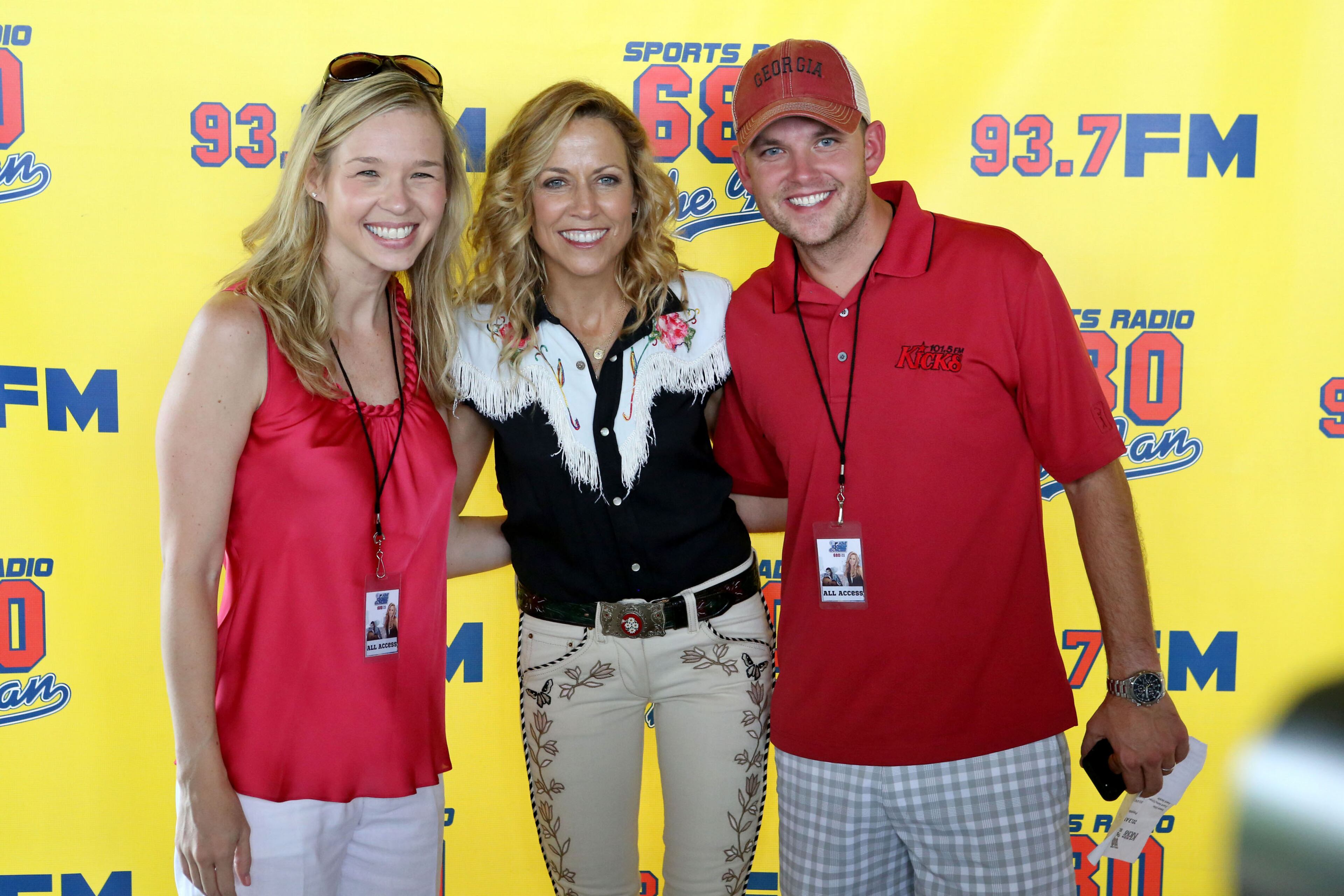 Sheryl Crow poses backstage with Jenn Hobby and Tug Cowart of radio sponsor Kicks 101.5 FM. Crow headlined the Chick-fil-A Kickoff concert Saturday afternoon at Centennial Olympic Park.