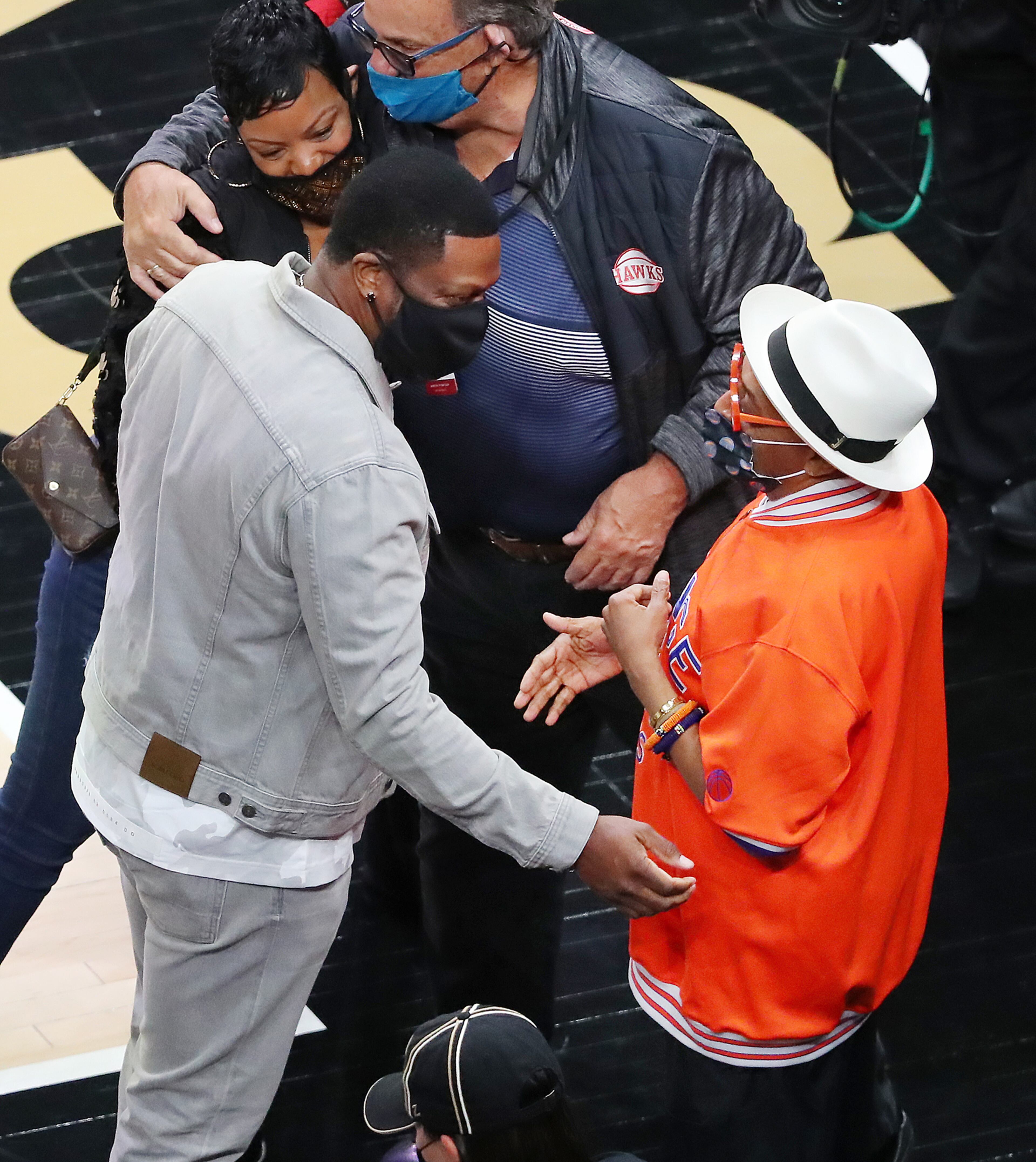 Comedian Chris Tucker (left) and director Spike Lee (right) greet one another while arriving for the Hawks' Game 4 matchup against the New York Knicks Sunday, May 30, 2021, at State Farm Arena in Atlanta. (Curtis Compton / Curtis.Compton@ajc.com)