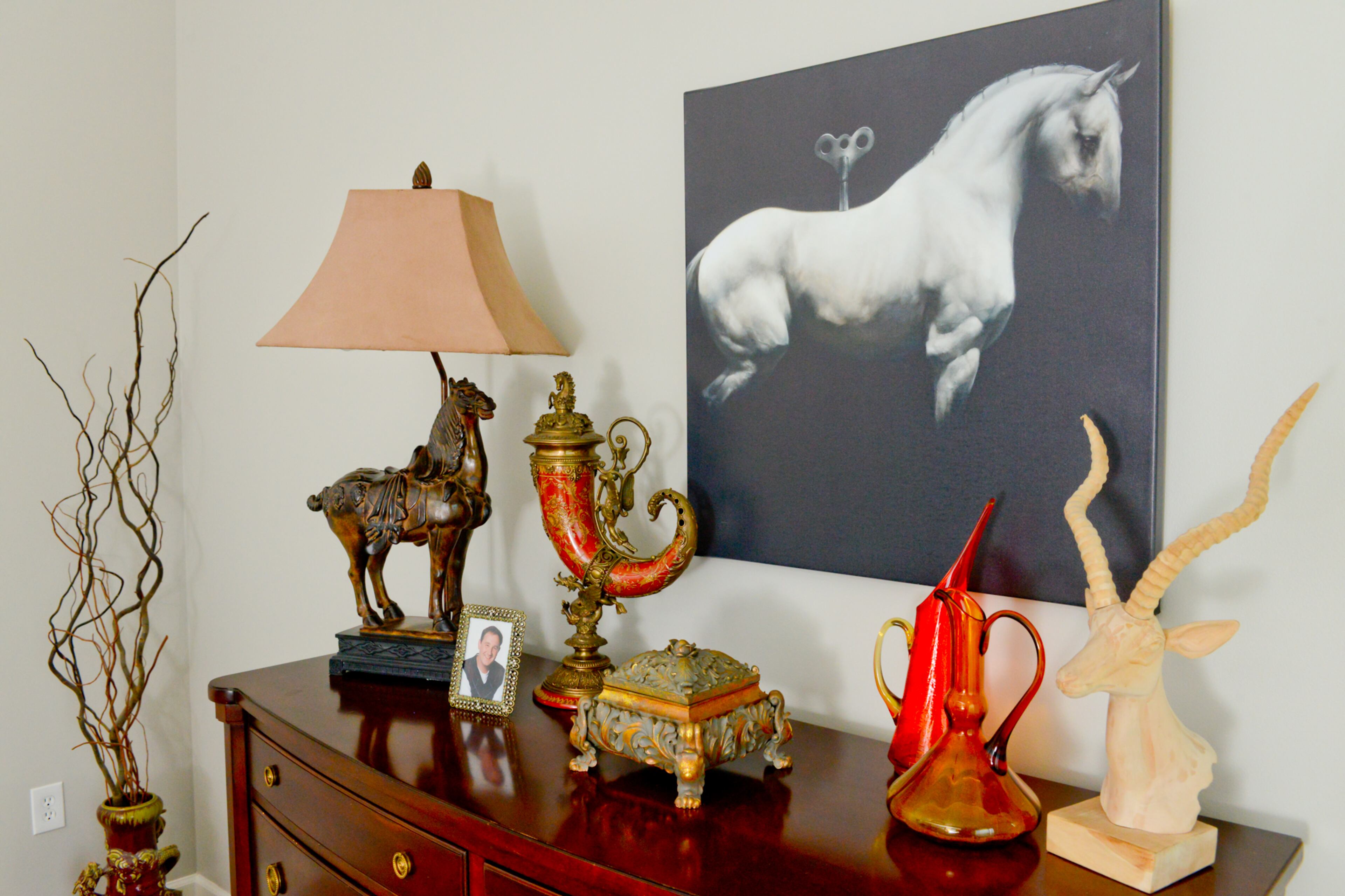 Homeowner Jeffrey Taylor Johnson considers white horses as powerful, almost mystical animals. Throughout his Atlanta home, Johnson features artwork of horses painted by the late Atlanta artist James McLaughlin Way. "The art shows the majestic strength in all the horses. I think they're very striking pieces," he said.