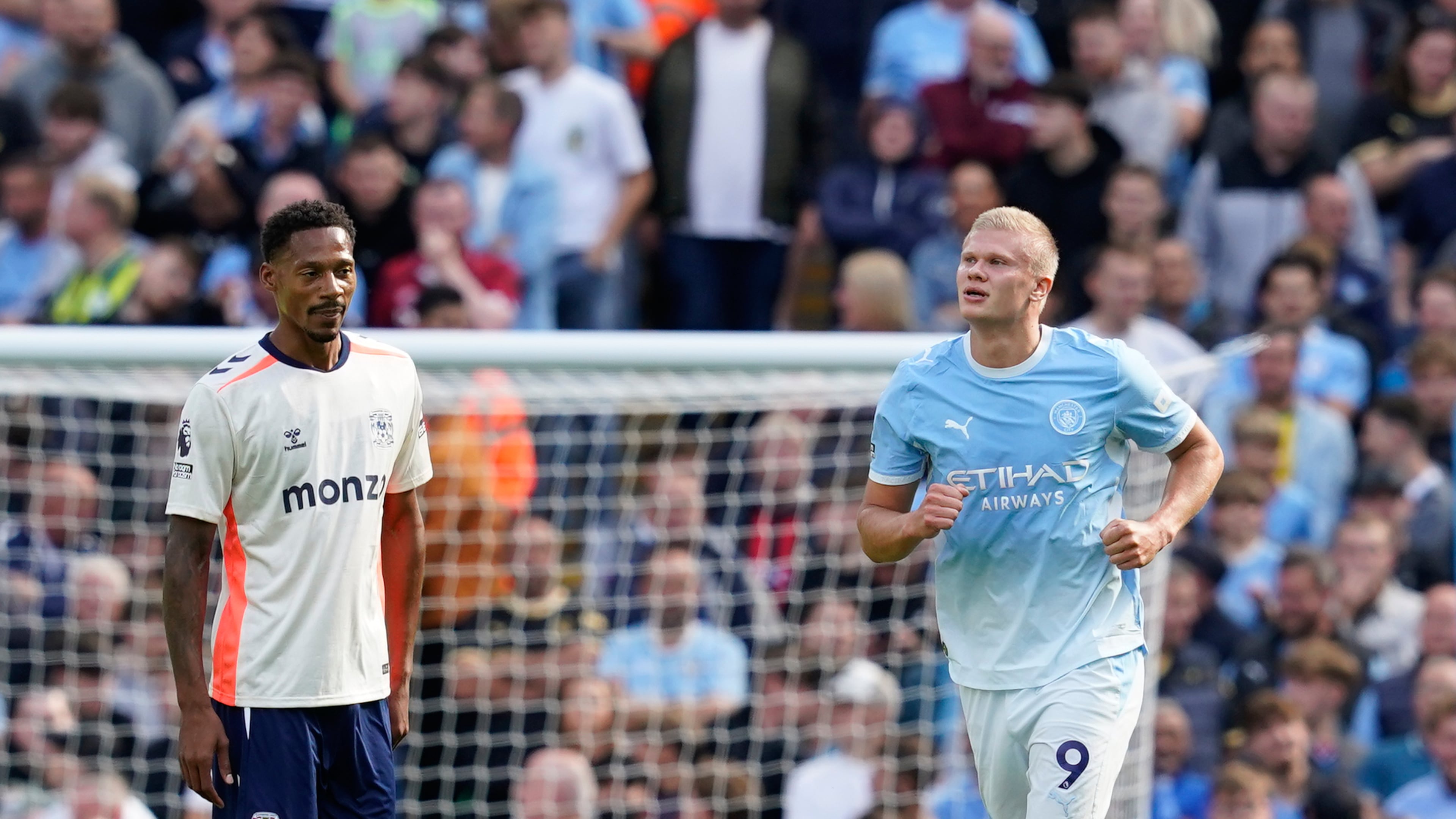 Manchester City's Erling Haaland, right, celebrates after scoring his side's opening goal during the English Premier League soccer match between Manchester City and Coventry City in Manchester, England, Saturday, Sept. 5, 2026. (AP Photo/Dave Thompson)